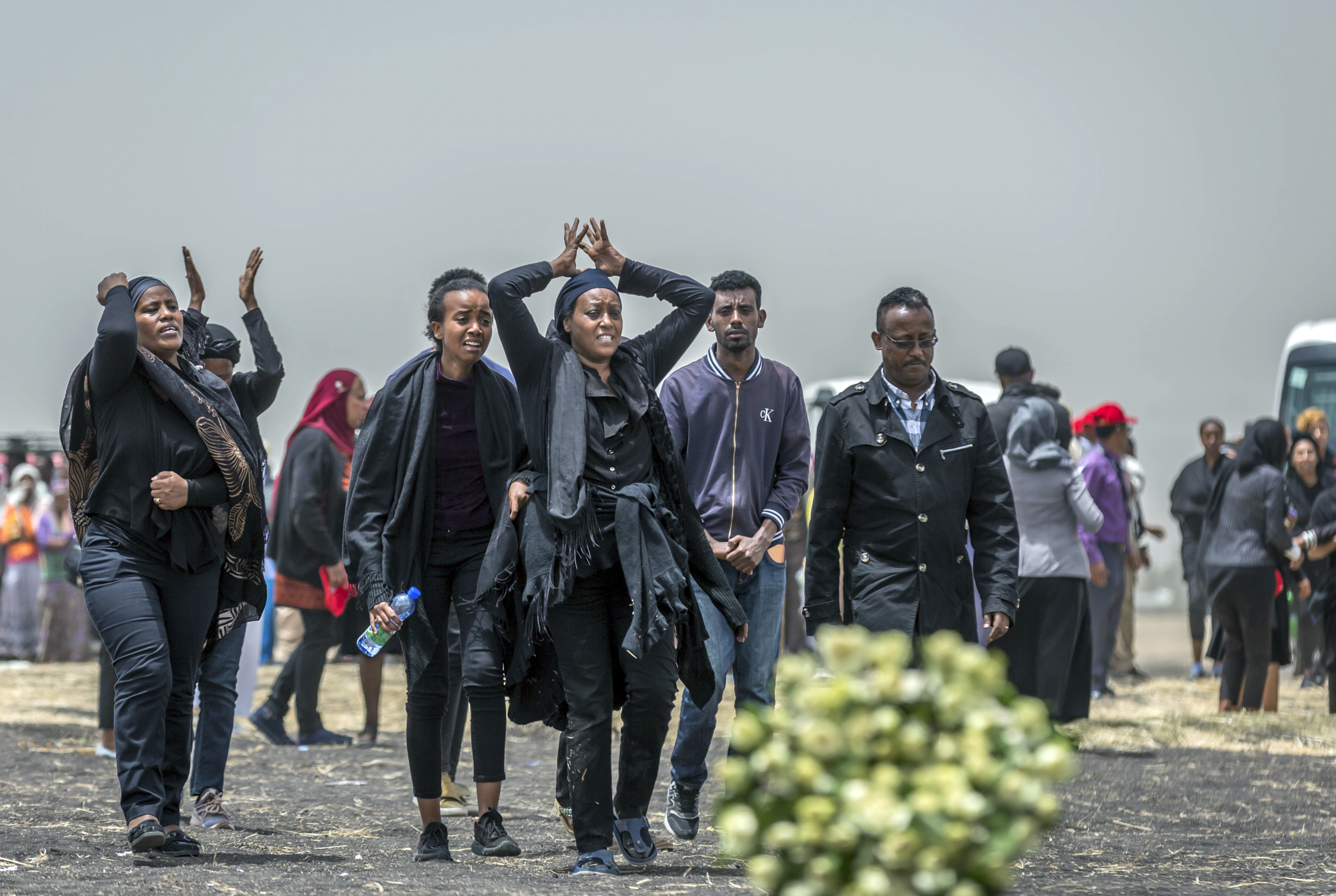 Ethiopian relatives of crash victims mourn at the scene where the Ethiopian Airlines Boeing 737 Max 8 crashed shortly after takeoff on Sunday killing all 157 on board, near Bishoftu, south-east of Addis Ababa, in Ethiopia Thursday, March 14, 2019. About 200 family members of people who died on the crashed jet stormed out of a briefing with Ethiopian Airlines officials in Addis Ababa on Thursday, complaining that the airline has not given them adequate information. (AP Photo/Mulugeta Ayene) Ethiopian relatives of crash victims mourn at the scene where the Ethiopian Airlines Boeing 737 Max 8 crashed shortly after takeoff on Sunday killing all 157 on board, near Bishoftu, south-east of Addis Ababa, in Ethiopia Thursday, March 14, 2019. About 200 family members of people who died on the crashed jet stormed out of a briefing with Ethiopian Airlines officials in Addis Ababa on Thursday, complaining that the airline has not given them adequate information. (AP Photo/Mulugeta Ayene)