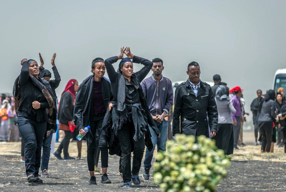 Ethiopian relatives of crash victims mourn at the scene where the Ethiopian Airlines Boeing 737 Max 8 crashed shortly after takeoff on Sunday killing all 157 on board, near Bishoftu, south-east of Addis Ababa, in Ethiopia Thursday, March 14, 2019. About 200 family members of people who died on the crashed jet stormed out of a briefing with Ethiopian Airlines officials in Addis Ababa on Thursday, complaining that the airline has not given them adequate information. (AP Photo/Mulugeta Ayene) Ethiopian relatives of crash victims mourn at the scene where the Ethiopian Airlines Boeing 737 Max 8 crashed shortly after takeoff on Sunday killing all 157 on board, near Bishoftu, south-east of Addis Ababa, in Ethiopia Thursday, March 14, 2019. About 200 family members of people who died on the crashed jet stormed out of a briefing with Ethiopian Airlines officials in Addis Ababa on Thursday, complaining that the airline has not given them adequate information. (AP Photo/Mulugeta Ayene)