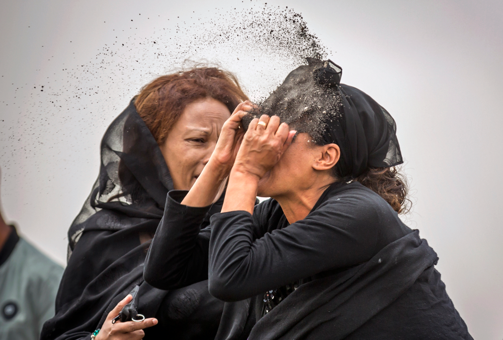 An Ethiopian relative of a crash victim throws dirt in her own face after realising that there is nothing physical left of her loved one, as she mourns at the scene where the Ethiopian Airlines Boeing 737 Max 8 crashed shortly after takeoff on Sunday killing all 157 on board, near Bishoftu, south-east of Addis Ababa, in Ethiopia Thursday, March 14, 2019. About 200 family members of people who died on the crashed jet stormed out of a briefing with Ethiopian Airlines officials in Addis Ababa on Thursday, complaining that the airline has not given them adequate information. (AP Photo/Mulugeta Ayene) An Ethiopian relative of a crash victim throws dirt in her own face after realising that there is nothing physical left of her loved one, as she mourns at the scene where the Ethiopian Airlines Boeing 737 Max 8 crashed shortly after takeoff on Sunday killing all 157 on board, near Bishoftu, south-east of Addis Ababa, in Ethiopia Thursday, March 14, 2019. About 200 family members of people who died on the crashed jet stormed out of a briefing with Ethiopian Airlines officials in Addis Ababa on Thursday, complaining that the airline has not given them adequate information. (AP Photo/Mulugeta Ayene)