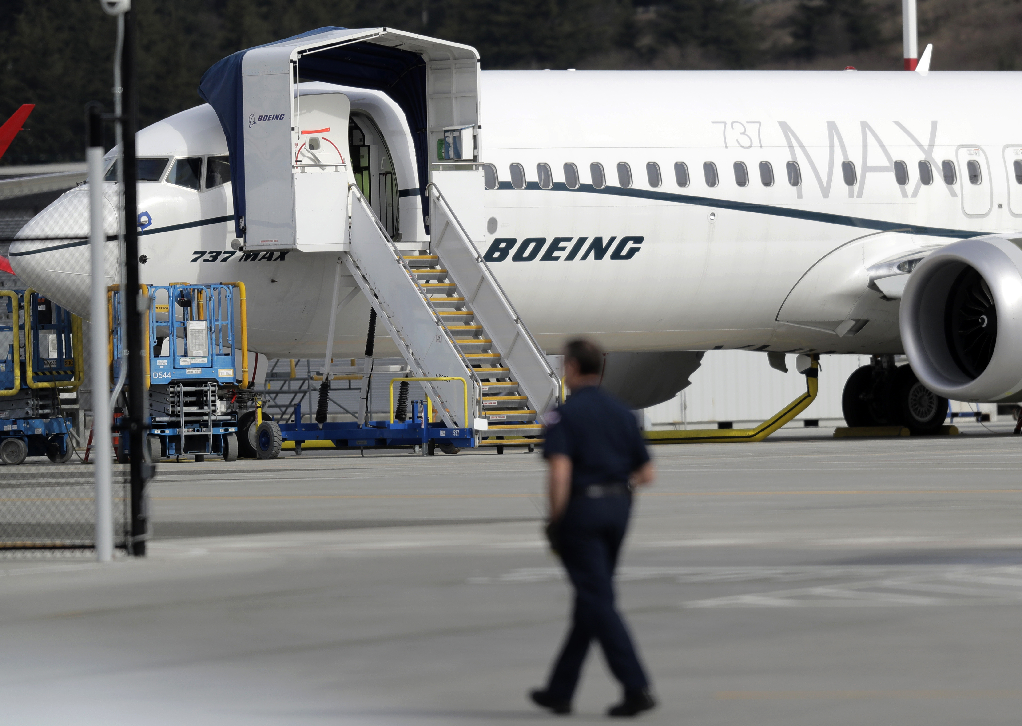 A worker walks next to a Boeing 737 MAX 8 airplane parked at Boeing Field, Thursday, March 14, 2019, in Seattle. The fatal crash Sunday of a 737 MAX 8 operated by Ethiopian Airlines was the second fatal flight for a Boeing 737 Max 8 in less than six months, and more than 40 countries, including the U.S., have now grounded the planes or refused to let them into their airspace. (AP Photo/Ted S. Warren) A worker walks next to a Boeing 737 MAX 8 airplane parked at Boeing Field, Thursday, March 14, 2019, in Seattle. The fatal crash Sunday of a 737 MAX 8 operated by Ethiopian Airlines was the second fatal flight for a Boeing 737 Max 8 in less than six months, and more than 40 countries, including the U.S., have now grounded the planes or refused to let them into their airspace. (AP Photo/Ted S. Warren)