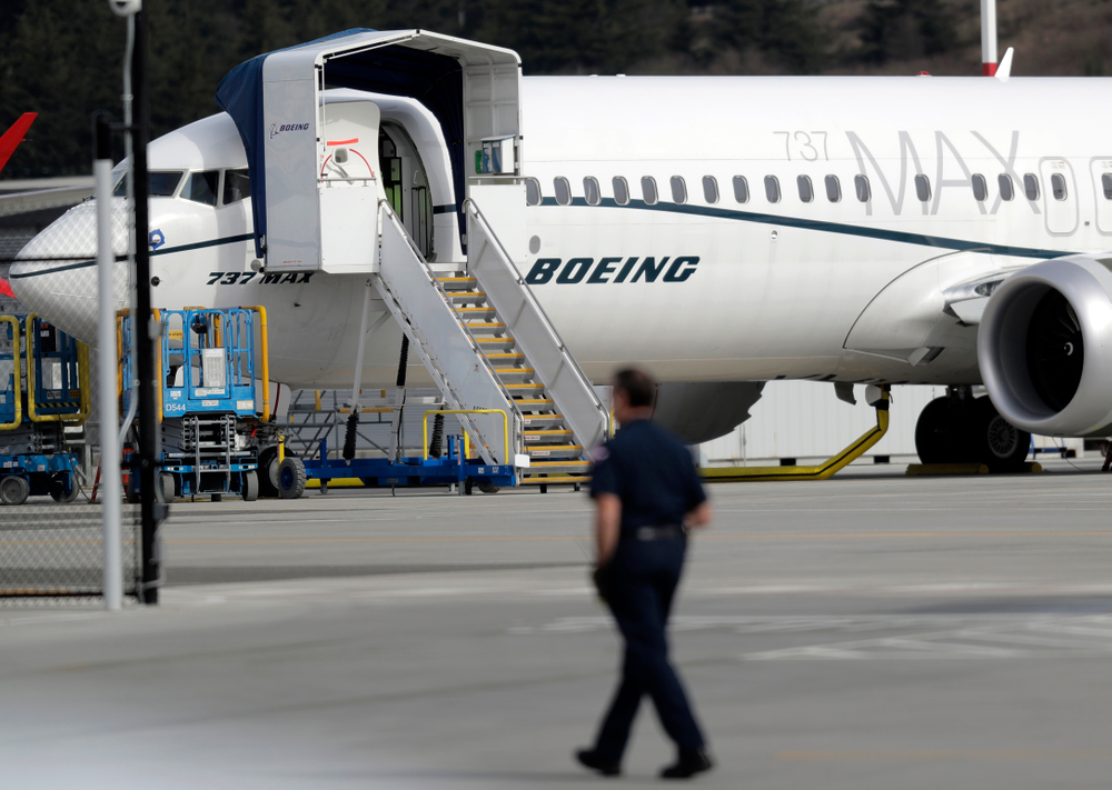 A worker walks next to a Boeing 737 MAX 8 airplane parked at Boeing Field, Thursday, March 14, 2019, in Seattle. The fatal crash Sunday of a 737 MAX 8 operated by Ethiopian Airlines was the second fatal flight for a Boeing 737 Max 8 in less than six months, and more than 40 countries, including the U.S., have now grounded the planes or refused to let them into their airspace. (AP Photo/Ted S. Warren) A worker walks next to a Boeing 737 MAX 8 airplane parked at Boeing Field, Thursday, March 14, 2019, in Seattle. The fatal crash Sunday of a 737 MAX 8 operated by Ethiopian Airlines was the second fatal flight for a Boeing 737 Max 8 in less than six months, and more than 40 countries, including the U.S., have now grounded the planes or refused to let them into their airspace. (AP Photo/Ted S. Warren)