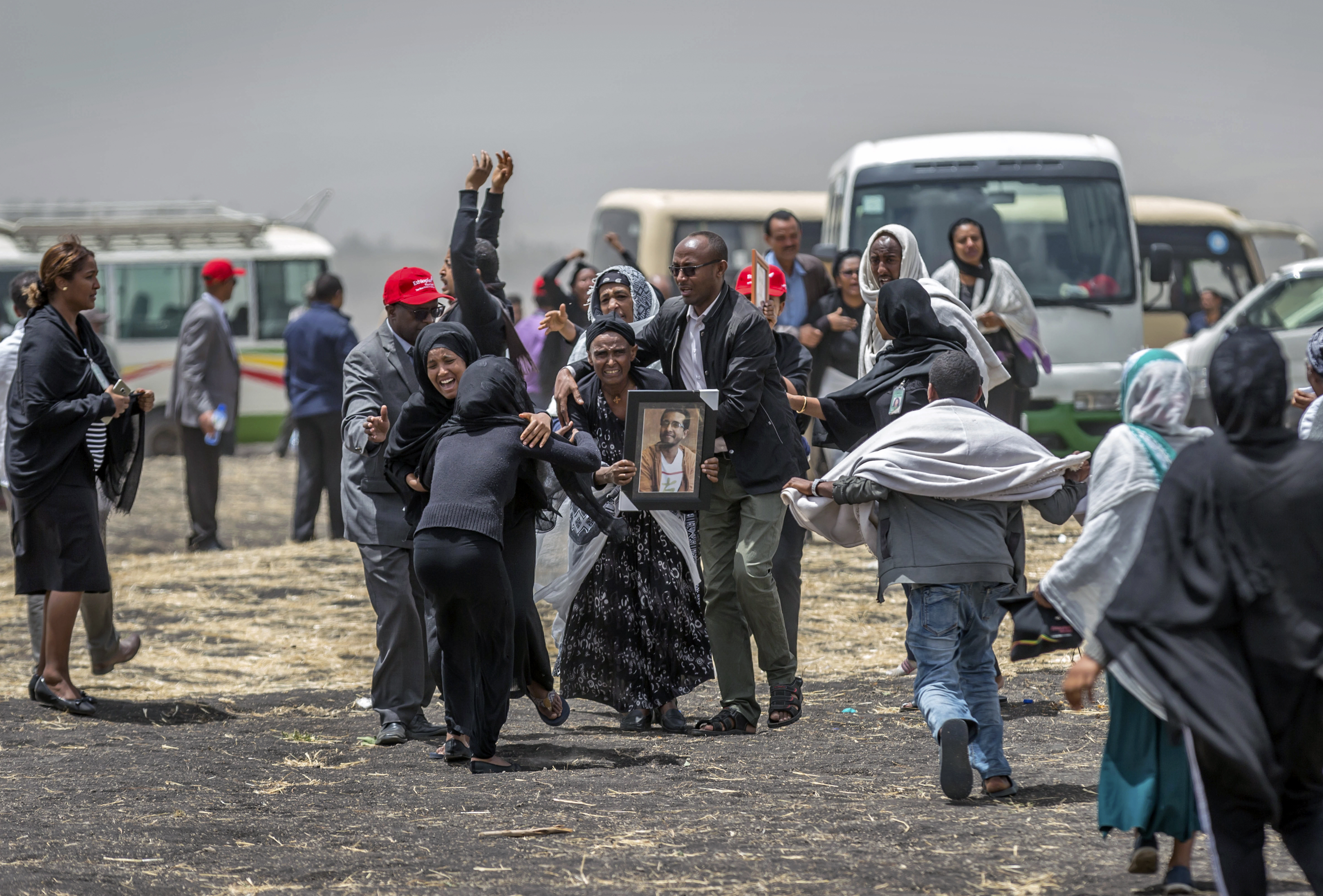 Ethiopian relatives of crash victims mourn at the scene where the Ethiopian Airlines Boeing 737 Max 8 crashed shortly after takeoff on Sunday killing all 157 on board, near Bishoftu, south-east of Addis Ababa, in Ethiopia Thursday, March 14, 2019. About 200 family members of people who died on the crashed jet stormed out of a briefing with Ethiopian Airlines officials in Addis Ababa on Thursday, complaining that the airline has not given them adequate information. (AP Photo/Mulugeta Ayene) Ethiopian relatives of crash victims mourn at the scene where the Ethiopian Airlines Boeing 737 Max 8 crashed shortly after takeoff on Sunday killing all 157 on board, near Bishoftu, south-east of Addis Ababa, in Ethiopia Thursday, March 14, 2019. About 200 family members of people who died on the crashed jet stormed out of a briefing with Ethiopian Airlines officials in Addis Ababa on Thursday, complaining that the airline has not given them adequate information. (AP Photo/Mulugeta Ayene)