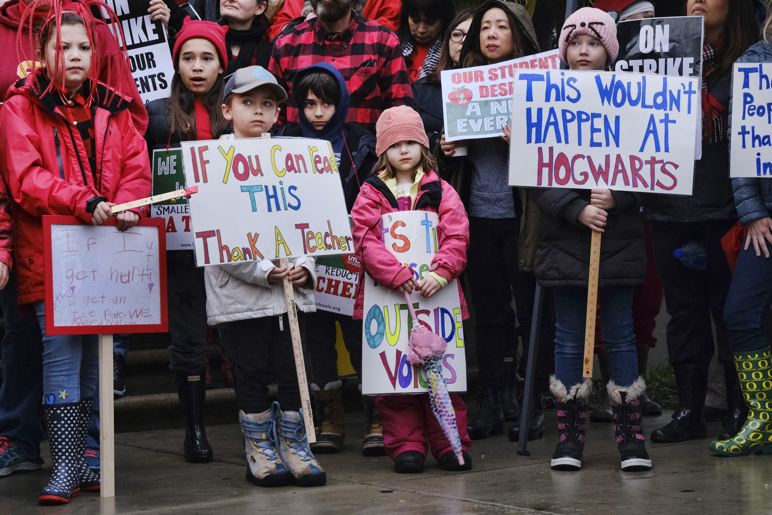 Elementary students, from right, Sawyer Mack is joined by his sisters, Capri and Kaya in support of a teachers strike in front of Hamilton High School in Los Angeles on Wed. Jan. 16, 2019. Los Angeles school administrators urged the union to resume bargaining as tens of thousands of teachers planned to walk picket lines for a third day Wednesday, after being joined on strike for the first time by some of their counterparts from independent charter schools. (AP Photo/Richard Vogel) Elementary students, from right, Sawyer Mack is joined by his sisters, Capri and Kaya in support of a teachers strike in front of Hamilton High School in Los Angeles on Wed. Jan. 16, 2019. Los Angeles school administrators urged the union to resume bargaining as tens of thousands of teachers planned to walk picket lines for a third day Wednesday, after being joined on strike for the first time by some of their counterparts from independent charter schools. (AP Photo/Richard Vogel)