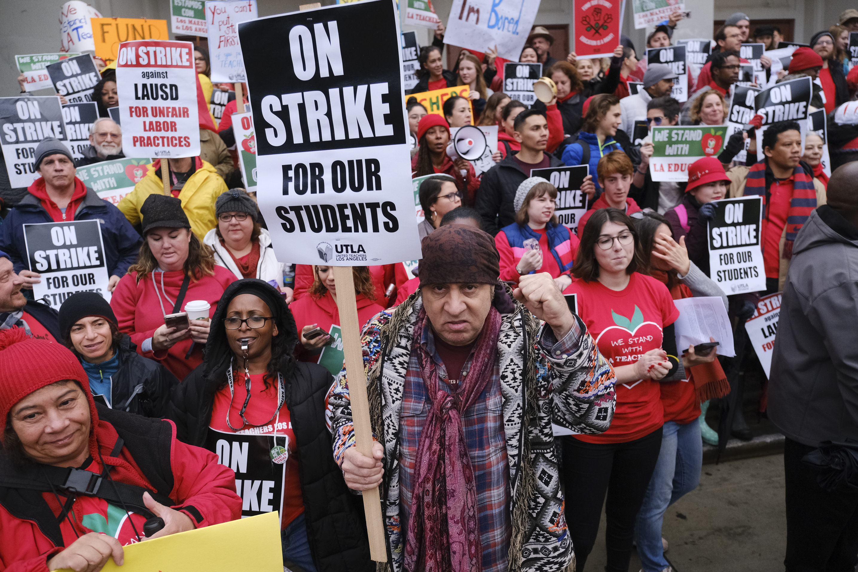 Actor, musician and activist, Steven Van Zandt, center, supports striking teachers on the picket in front of Hamilton High School in Los Angeles on Wednesday, Jan. 16, 2019. School administrators urged the union to resume bargaining as tens of thousands of teachers planned to walk picket lines for a third day Wednesday. (AP Photo/Richard Vogel) Actor, musician and activist, Steven Van Zandt, center, supports striking teachers on the picket in front of Hamilton High School in Los Angeles on Wednesday, Jan. 16, 2019. School administrators urged the union to resume bargaining as tens of thousands of teachers planned to walk picket lines for a third day Wednesday. (AP Photo/Richard Vogel)