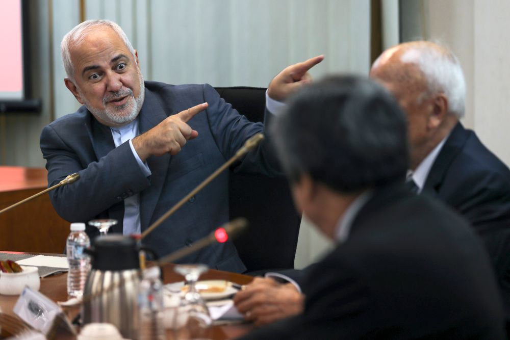 Iranian Foreign Minister Mohammad Javad Zarif, left, gestures as he speaks during a forum titled Iranian Foreign Minister Mohammad Javad Zarif, left, gestures as he speaks during a forum titled