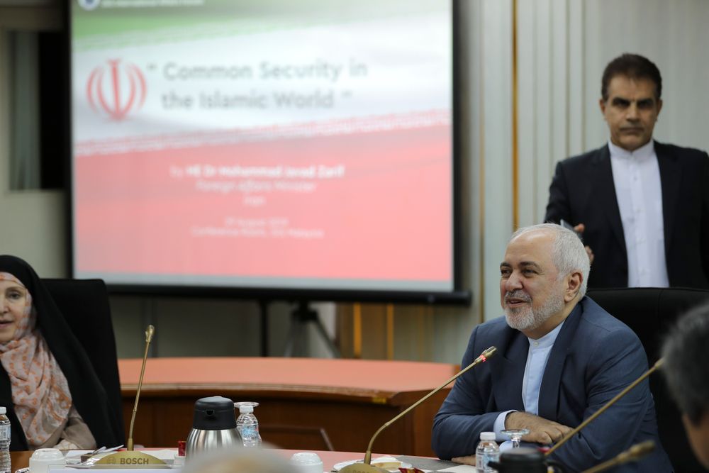 Iranian Foreign Minister Mohammad Javad Zarif, right, speaks during a forum titled Iranian Foreign Minister Mohammad Javad Zarif, right, speaks during a forum titled