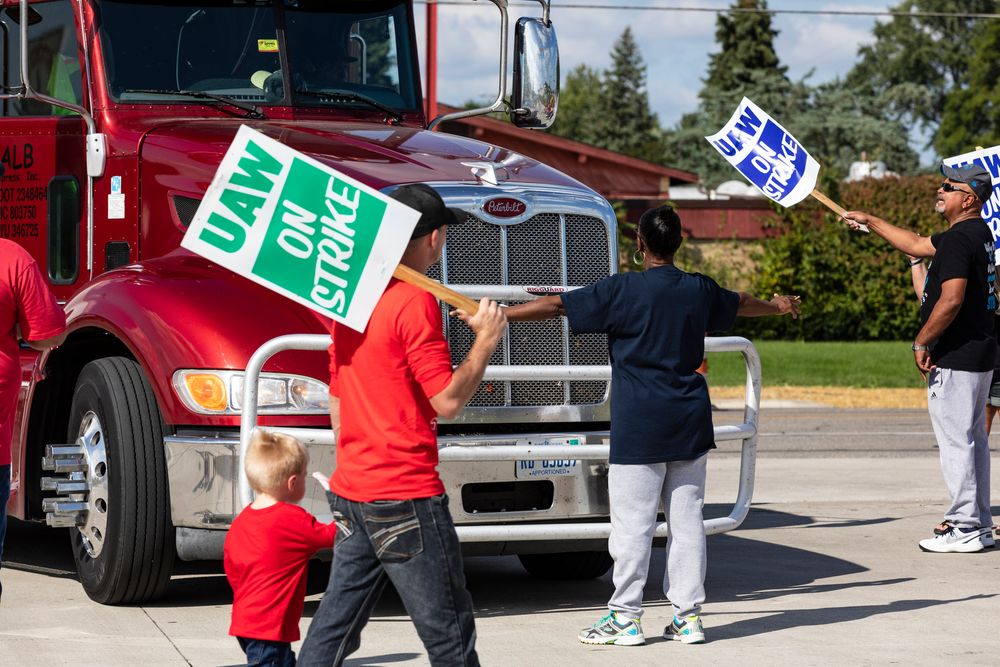Retired GM union member Roxanne Williams, 63, stood-up to a semi-truck attempting to enter the GM Davison Road Processing Center. United Automobile Workers remain on strike against GM on Tuesday, Sept. 17, 2019 in Burton, Mich. Williams has worked for GM for 20 years. (Sara Faraj/The Flint Journal via AP) Retired GM union member Roxanne Williams, 63, stood-up to a semi-truck attempting to enter the GM Davison Road Processing Center. United Automobile Workers remain on strike against GM on Tuesday, Sept. 17, 2019 in Burton, Mich. Williams has worked for GM for 20 years. (Sara Faraj/The Flint Journal via AP)