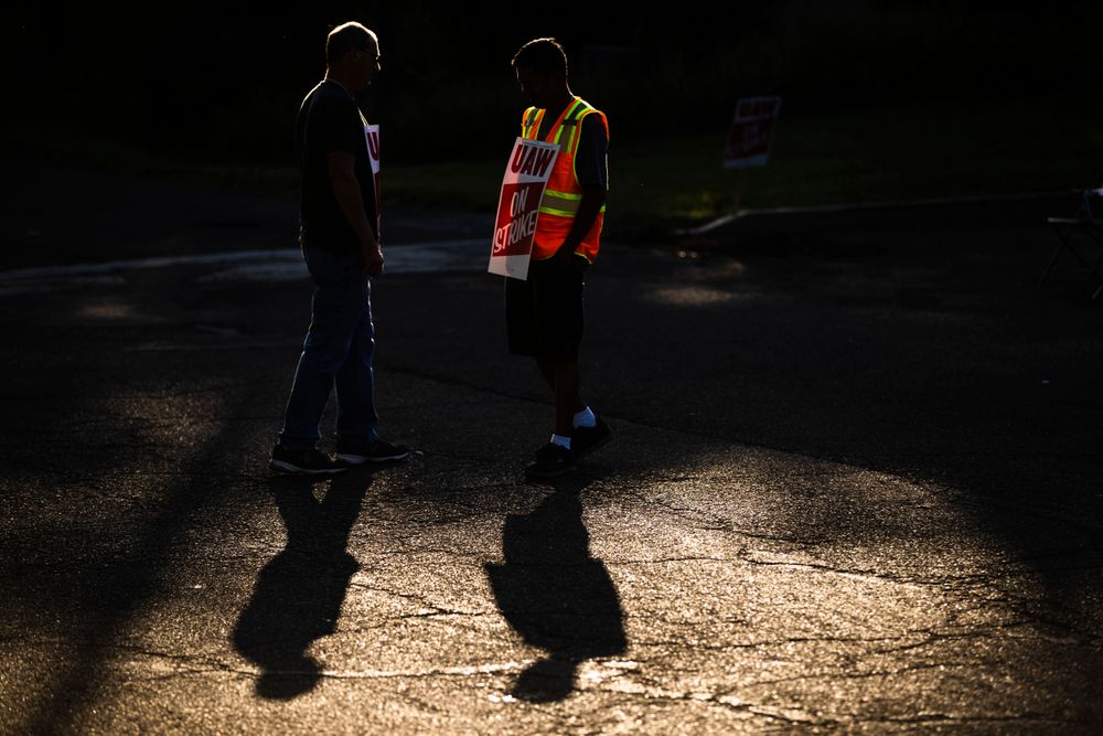 Workers Mike Jones, left, and Joel Inocencio, demonstrative outside a General Motors facility in Langhorne, Pa., Tuesday, Sept. 17, 2019. More than 49,000 members of the United Auto Workers walked off General Motors factory floors or set up picket lines early Monday as contract talks with the company deteriorated into a strike. (AP Photo/Matt Rourke) Workers Mike Jones, left, and Joel Inocencio, demonstrative outside a General Motors facility in Langhorne, Pa., Tuesday, Sept. 17, 2019. More than 49,000 members of the United Auto Workers walked off General Motors factory floors or set up picket lines early Monday as contract talks with the company deteriorated into a strike. (AP Photo/Matt Rourke)