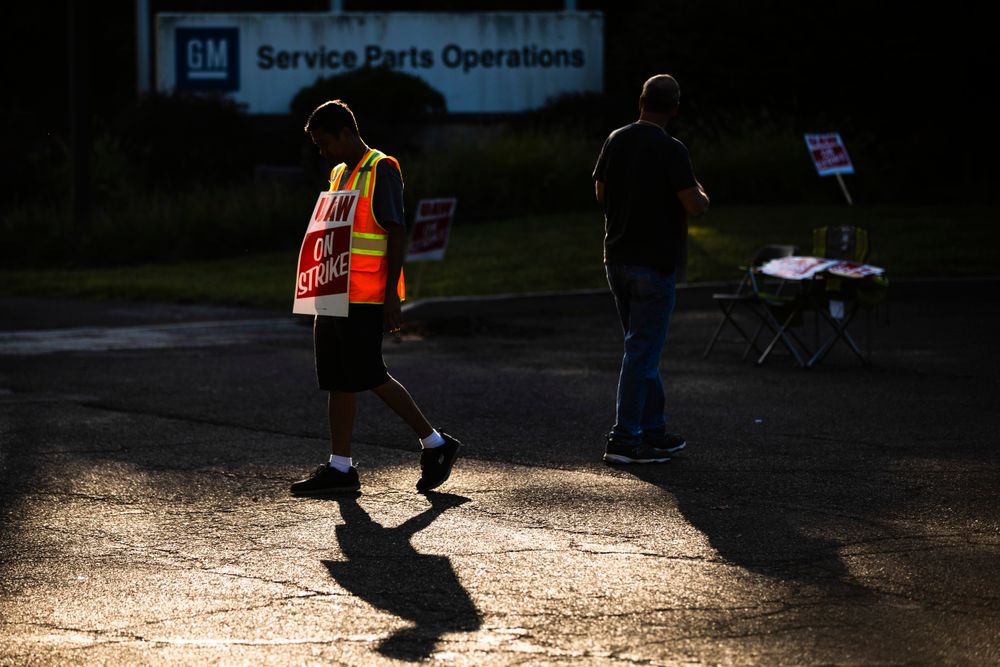 Workers Joel Inocencio, left, and Mike Jones demonstrative outside a General Motors facility in Langhorne, Pa., Tuesday, Sept. 17, 2019. More than 49,000 members of the United Auto Workers walked off General Motors factory floors or set up picket lines early Monday as contract talks with the company deteriorated into a strike. (AP Photo/Matt Rourke) Workers Joel Inocencio, left, and Mike Jones demonstrative outside a General Motors facility in Langhorne, Pa., Tuesday, Sept. 17, 2019. More than 49,000 members of the United Auto Workers walked off General Motors factory floors or set up picket lines early Monday as contract talks with the company deteriorated into a strike. (AP Photo/Matt Rourke)