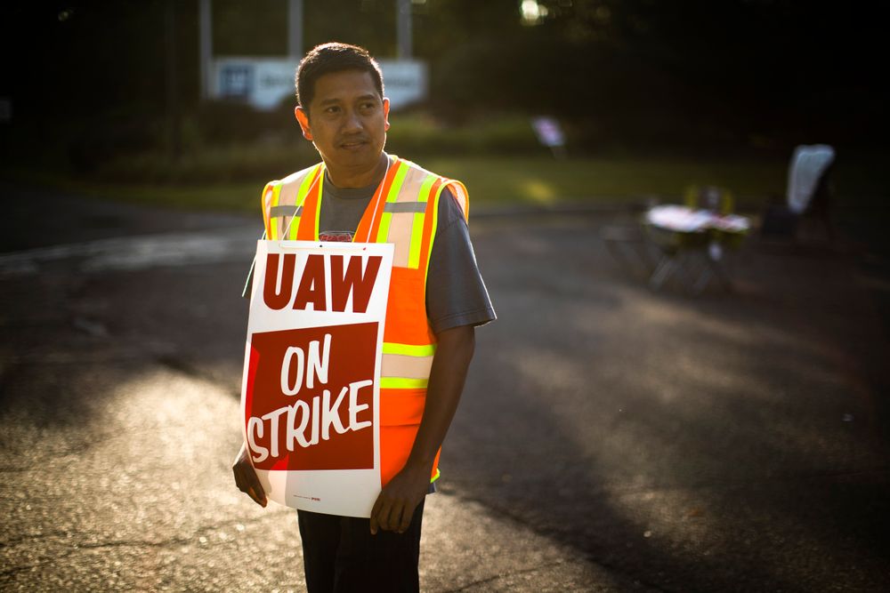 Worker Joel Inocencio demonstratives outside a General Motors facility in Langhorne, Pa., Tuesday, Sept. 17, 2019. More than 49,000 members of the United Auto Workers walked off General Motors factory floors or set up picket lines early Monday as contract talks with the company deteriorated into a strike. (AP Photo/Matt Rourke) Worker Joel Inocencio demonstratives outside a General Motors facility in Langhorne, Pa., Tuesday, Sept. 17, 2019. More than 49,000 members of the United Auto Workers walked off General Motors factory floors or set up picket lines early Monday as contract talks with the company deteriorated into a strike. (AP Photo/Matt Rourke)