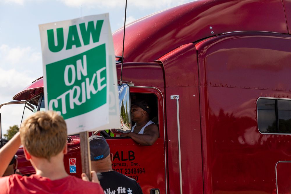 A semi-truck driver entering the GM Davison Road Processing Center in Burton passes union members striking. United Automobile Workers remain on strike against GM on Tuesday, Sept. 17, 2019 in Burton, Mich. (Sara Faraj/The Flint Journal via AP) A semi-truck driver entering the GM Davison Road Processing Center in Burton passes union members striking. United Automobile Workers remain on strike against GM on Tuesday, Sept. 17, 2019 in Burton, Mich. (Sara Faraj/The Flint Journal via AP)