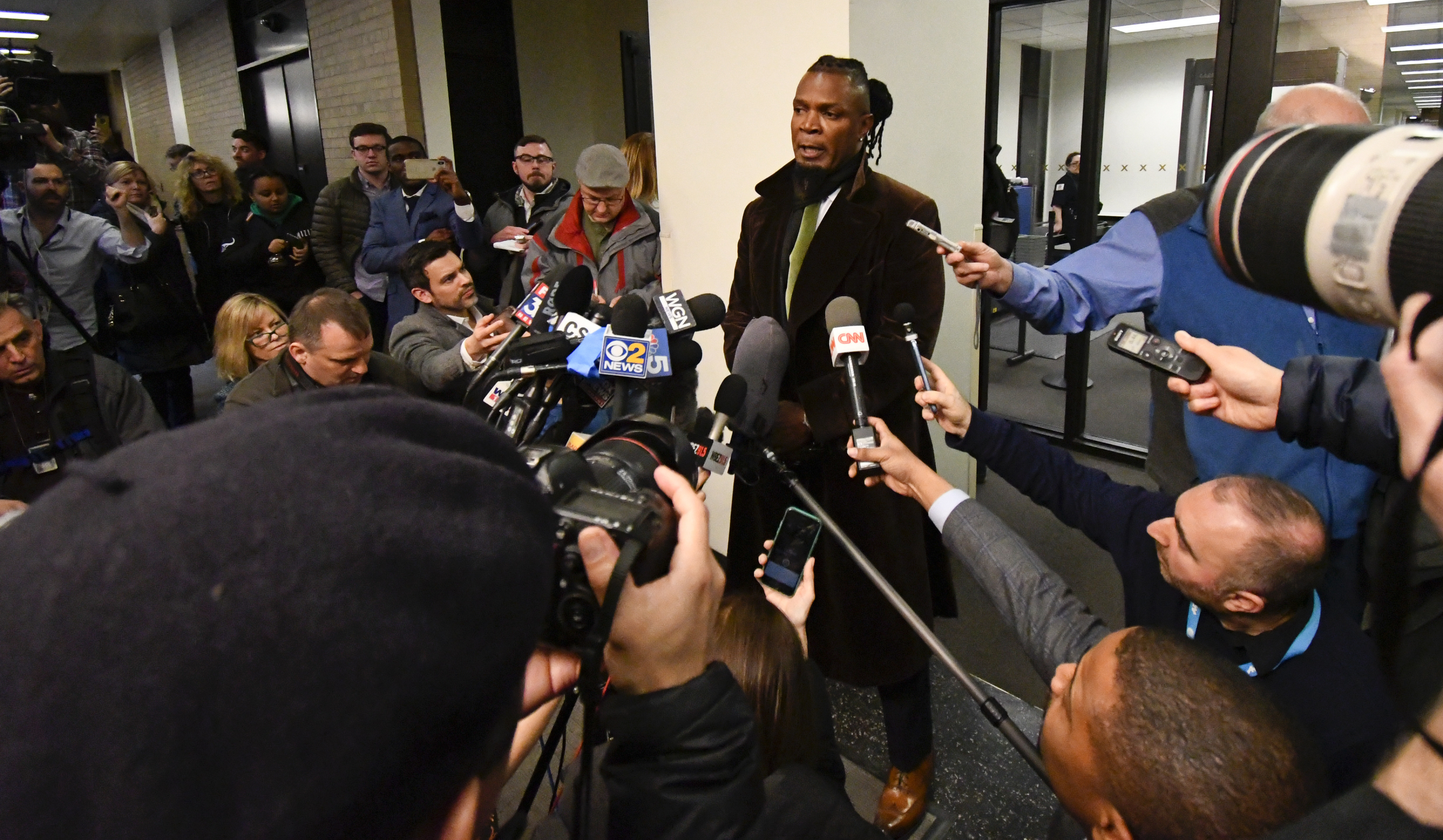 Darryll Johnson, publicist for musician R. Kelly speaks to the media at the Daley Center after a hearing in Kelly's child support case in which he allegedly owes $161,663 to his ex-wife, at the Daley Center, Wednesday, March 6, 2019, in Chicago. R. Kelly was arrested and sent back to jail. (AP Photo/Matt Marton) Darryll Johnson, publicist for musician R. Kelly speaks to the media at the Daley Center after a hearing in Kelly's child support case in which he allegedly owes $161,663 to his ex-wife, at the Daley Center, Wednesday, March 6, 2019, in Chicago. R. Kelly was arrested and sent back to jail. (AP Photo/Matt Marton)