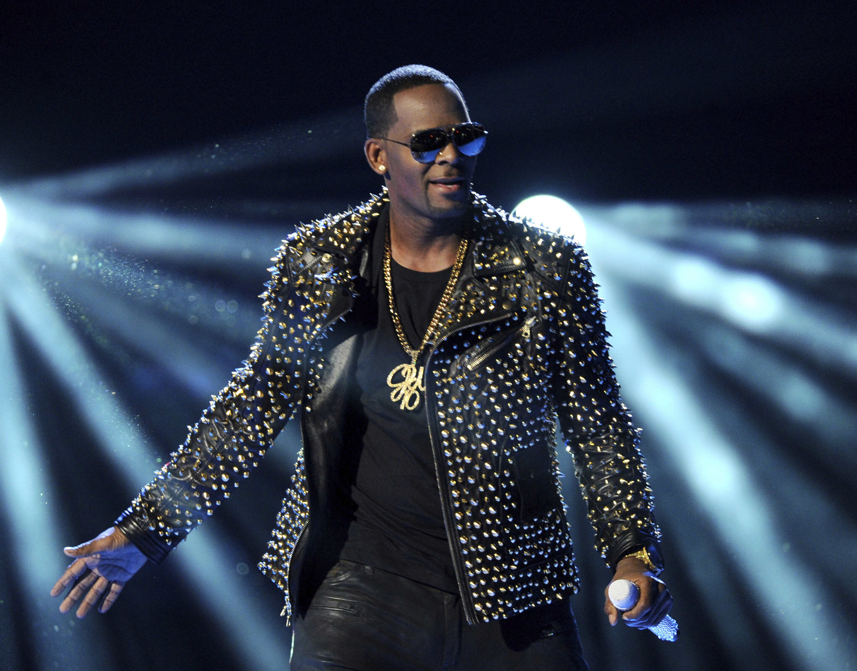 FILE - In this June 30, 2013 file photo, R. Kelly performs at the BET Awards in Los Angeles. In his first interview since being charged with sexually abusing four people, including three underage girls, R. Kelly says he FILE - In this June 30, 2013 file photo, R. Kelly performs at the BET Awards in Los Angeles. In his first interview since being charged with sexually abusing four people, including three underage girls, R. Kelly says he