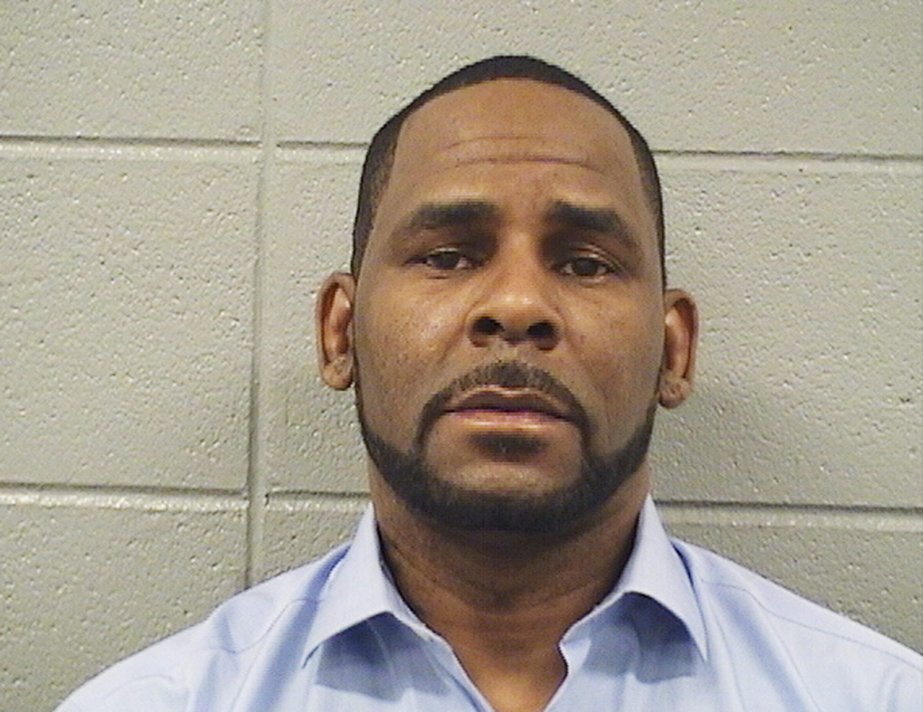 In this Wednesday, March 6, 2019 booking photo released by the Cook County Sheriff’s Office is R. Kelly. A Cook County Sheriff's Office official says singer Kelly won't be released from jail until he pays $161,000 in back child support he owes. Sheriff's office spokeswoman Sophia Ansari says Kelly was taken into custody Wednesday during a hearing over the child support and that his next hearing is scheduled for next Wednesday, March 13. (Cook County Sheriff’s Office via AP) In this Wednesday, March 6, 2019 booking photo released by the Cook County Sheriff’s Office is R. Kelly. A Cook County Sheriff's Office official says singer Kelly won't be released from jail until he pays $161,000 in back child support he owes. Sheriff's office spokeswoman Sophia Ansari says Kelly was taken into custody Wednesday during a hearing over the child support and that his next hearing is scheduled for next Wednesday, March 13. (Cook County Sheriff’s Office via AP)