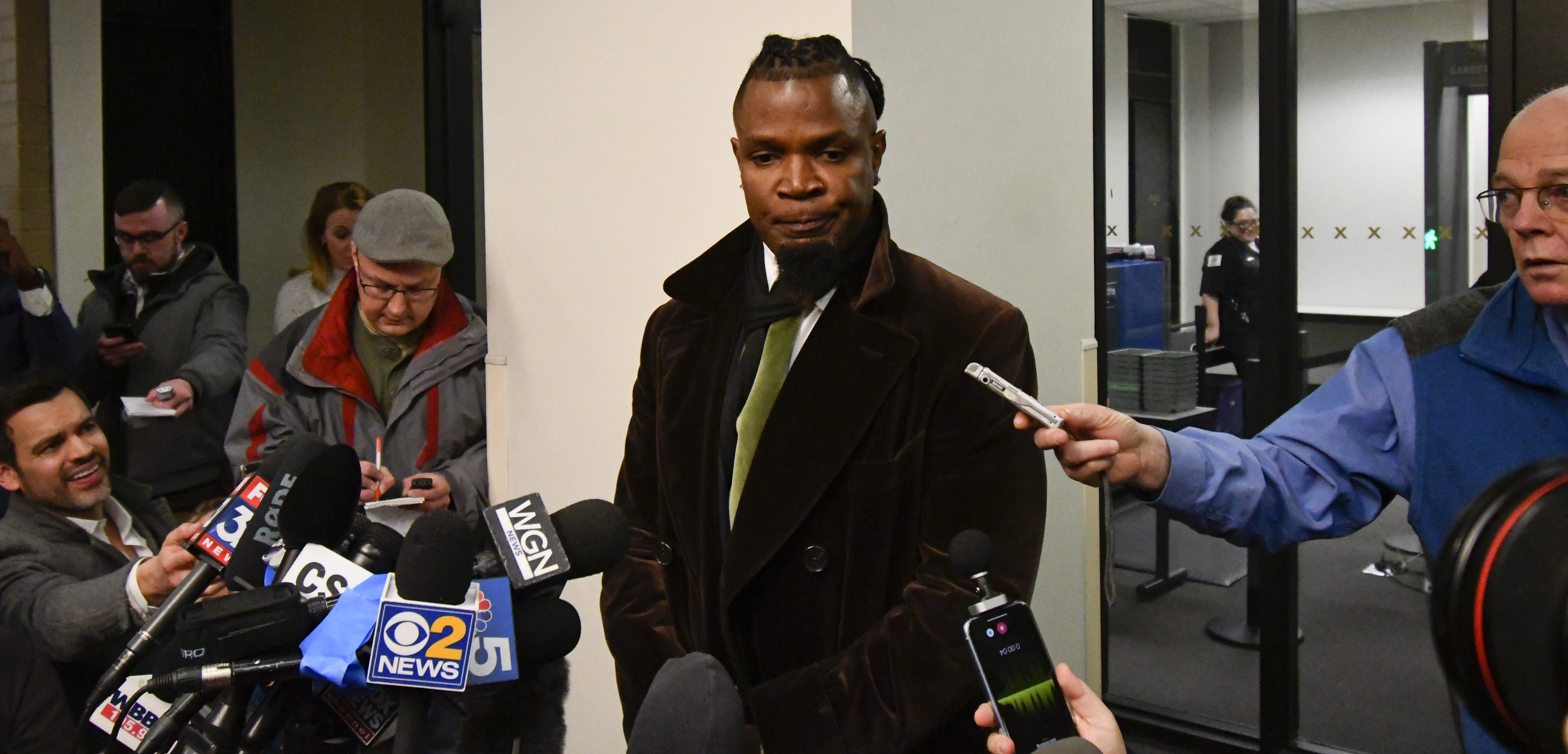 Darryll Johnson, publicist for musician R. Kelly speaks to the media at the Daley Center after a hearing in Kelly's child support case in which he allegedly owes $161,663 to his ex-wife, at the Daley Center, Wednesday, March 6, 2019, in Chicago. R. Kelly was arrested and sent back to jail. (AP Photo/Matt Marton) Darryll Johnson, publicist for musician R. Kelly speaks to the media at the Daley Center after a hearing in Kelly's child support case in which he allegedly owes $161,663 to his ex-wife, at the Daley Center, Wednesday, March 6, 2019, in Chicago. R. Kelly was arrested and sent back to jail. (AP Photo/Matt Marton)