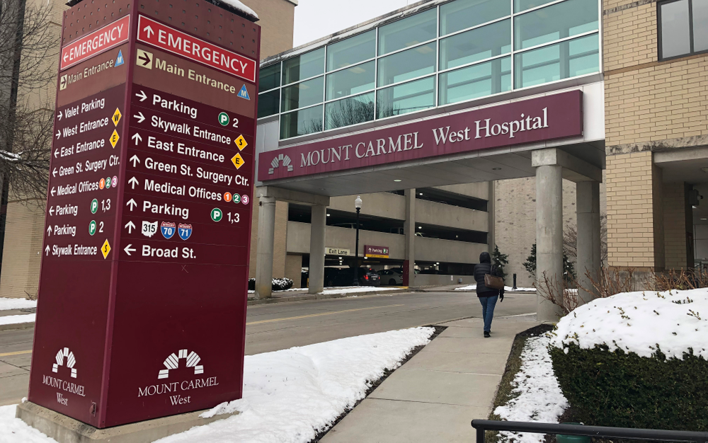 FILE - This Jan. 15, 2019 file photo shows the main entrance to Mount Carmel West Hospital in Columbus, Ohio. Authorities are set to give an update on the criminal investigation of an intensive care doctor accused of ordering possibly fatal painkillers for dozens of Ohio hospital patients. The Franklin County prosecutor and Columbus police scheduled a news conference Wednesday, June 5, to discuss the investigation of Dr. William Husel. (AP Photo/Andrew Welsh Huggins, File) FILE - This Jan. 15, 2019 file photo shows the main entrance to Mount Carmel West Hospital in Columbus, Ohio. Authorities are set to give an update on the criminal investigation of an intensive care doctor accused of ordering possibly fatal painkillers for dozens of Ohio hospital patients. The Franklin County prosecutor and Columbus police scheduled a news conference Wednesday, June 5, to discuss the investigation of Dr. William Husel. (AP Photo/Andrew Welsh Huggins, File)