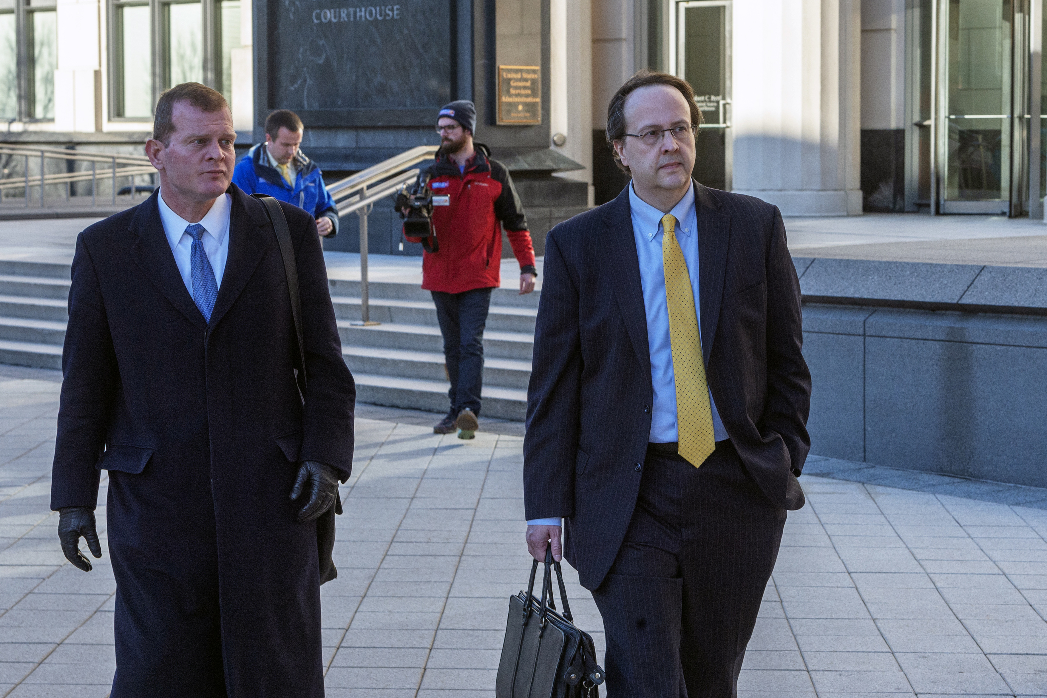 Former West Virginia Supreme Court Justice Allen Loughry, right, emerges with his lawyer John Carr from the Robert C. Byrd United States Courthouse after his sentencing, Wednesday, Feb. 13, 2019 in Charleston, W.Va. Loughry, a former West Virginia Supreme Court justice who had a $32,000 blue suede couch in his office and was at the center of an impeachment scandal has been sentenced to two years behind bars. (Craig Hudson/Charleston Gazette-Mail via AP) Former West Virginia Supreme Court Justice Allen Loughry, right, emerges with his lawyer John Carr from the Robert C. Byrd United States Courthouse after his sentencing, Wednesday, Feb. 13, 2019 in Charleston, W.Va. Loughry, a former West Virginia Supreme Court justice who had a $32,000 blue suede couch in his office and was at the center of an impeachment scandal has been sentenced to two years behind bars. (Craig Hudson/Charleston Gazette-Mail via AP)