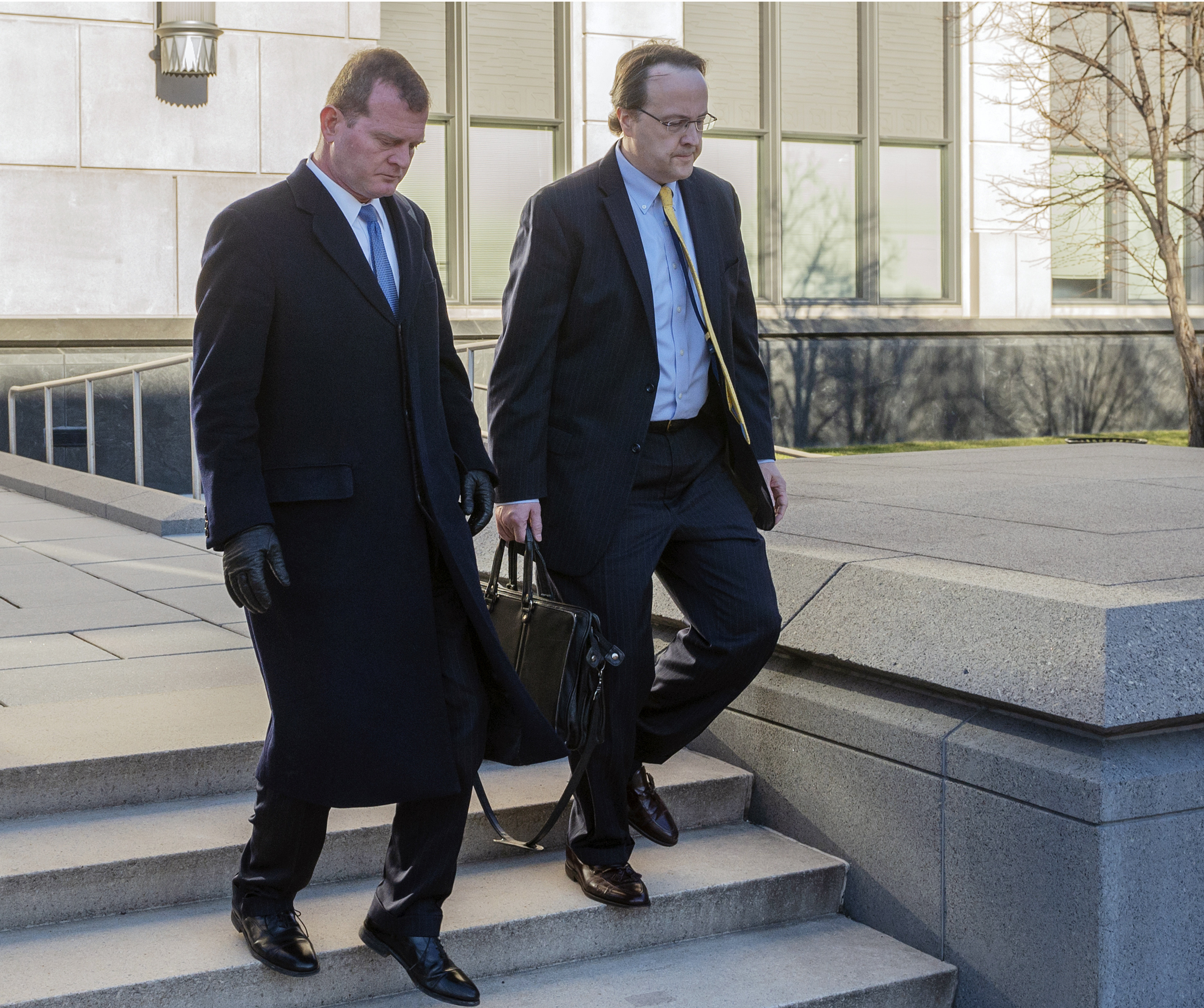 Former West Virginia Supreme Court Justice Allen Loughry, right, emerges with his lawyer John Carr from the Robert C. Byrd United States Courthouse after his sentencing, Wednesday, Feb. 13, 2019 in Charleston, W.Va. Loughry, a former West Virginia Supreme Court justice who had a $32,000 blue suede couch in his office and was at the center of an impeachment scandal has been sentenced to two years behind bars. (Craig Hudson/Charleston Gazette-Mail via AP) Former West Virginia Supreme Court Justice Allen Loughry, right, emerges with his lawyer John Carr from the Robert C. Byrd United States Courthouse after his sentencing, Wednesday, Feb. 13, 2019 in Charleston, W.Va. Loughry, a former West Virginia Supreme Court justice who had a $32,000 blue suede couch in his office and was at the center of an impeachment scandal has been sentenced to two years behind bars. (Craig Hudson/Charleston Gazette-Mail via AP)