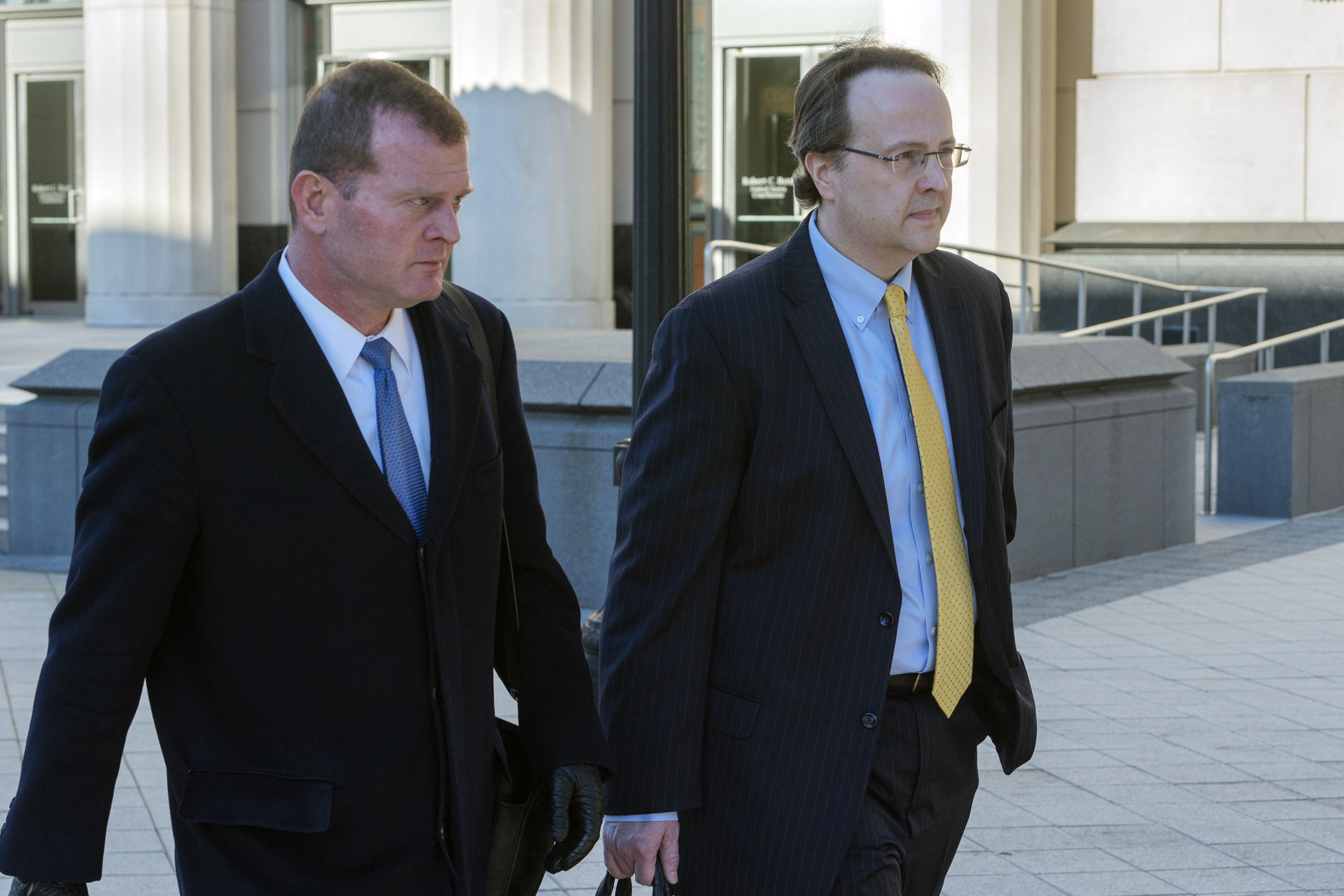Former West Virginia Supreme Court Justice Allen Loughry, right, emerges with his lawyer John Carr from the Robert C. Byrd United States Courthouse after his sentencing, Wednesday, Feb. 13, 2019 in Charleston, W.Va. Loughry, a former West Virginia Supreme Court justice who had a $32,000 blue suede couch in his office and was at the center of an impeachment scandal has been sentenced to two years behind bars. (Craig Hudson/Charleston Gazette-Mail via AP) Former West Virginia Supreme Court Justice Allen Loughry, right, emerges with his lawyer John Carr from the Robert C. Byrd United States Courthouse after his sentencing, Wednesday, Feb. 13, 2019 in Charleston, W.Va. Loughry, a former West Virginia Supreme Court justice who had a $32,000 blue suede couch in his office and was at the center of an impeachment scandal has been sentenced to two years behind bars. (Craig Hudson/Charleston Gazette-Mail via AP)