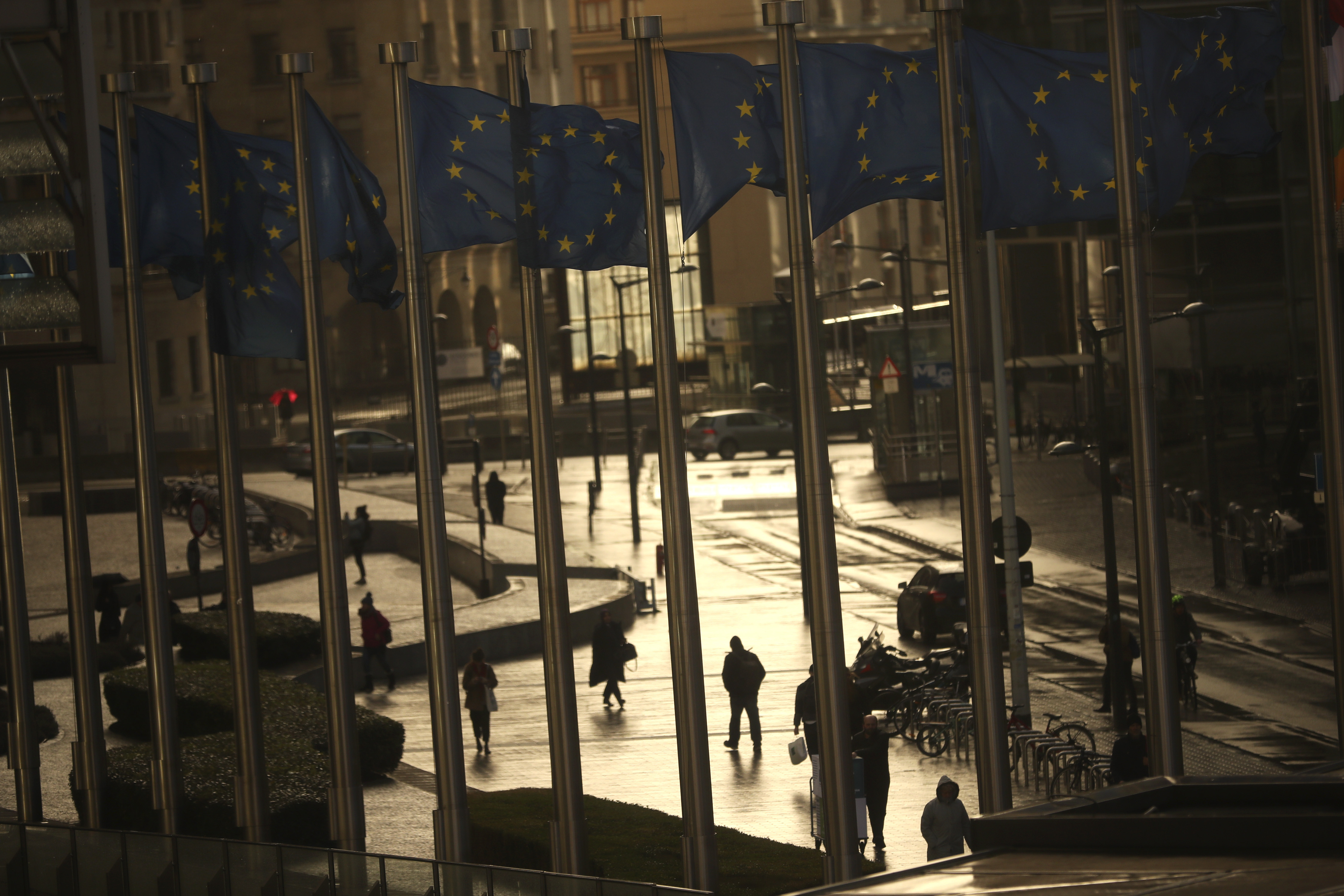 Commuters walk past European Union flags outside the European Commission headquarters in Brussels, Thursday, March 7, 2019. Brexit negotiations between Britain with the European Union will continue through the weekend, the country's chief law officer said Thursday as the U.K. scrambled to secure changes to the divorce deal before a vote in Parliament next week. (AP Photo/Francisco Seco) Commuters walk past European Union flags outside the European Commission headquarters in Brussels, Thursday, March 7, 2019. Brexit negotiations between Britain with the European Union will continue through the weekend, the country's chief law officer said Thursday as the U.K. scrambled to secure changes to the divorce deal before a vote in Parliament next week. (AP Photo/Francisco Seco)