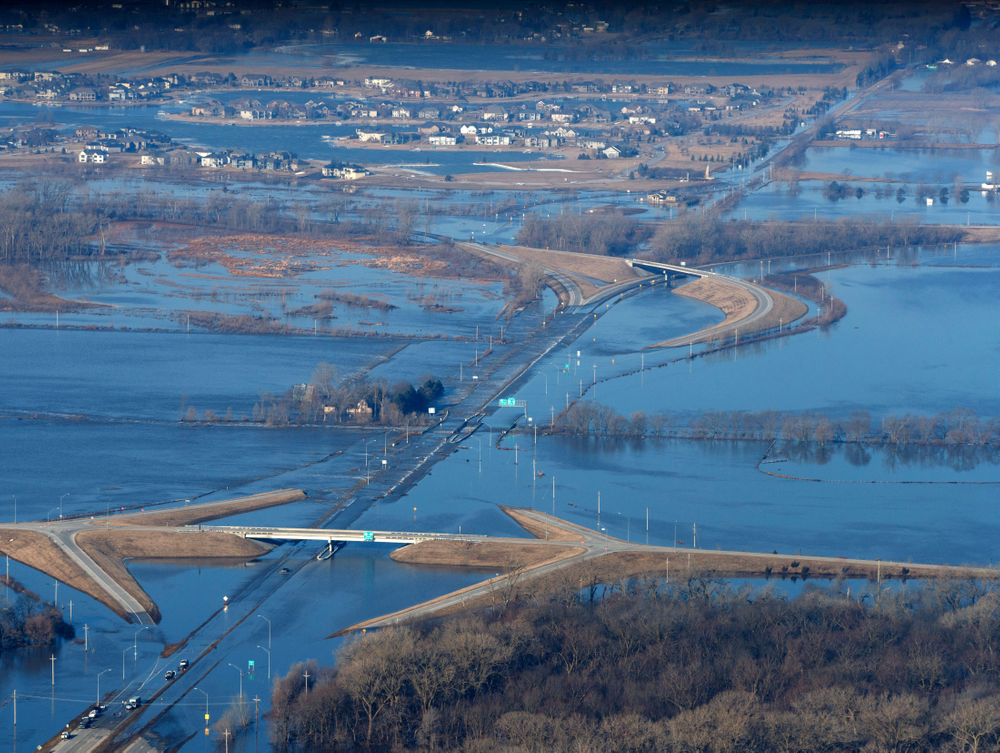 CORRECTS MONTH TO MARCH NOT MAY - The Elkhorn River consumes a section of western Douglas County Sunday, March 17, 2019, in Omaha, Neb. Hundreds of people were evacuated from their homes in Nebraska and Iowa as levees succumbed to the rush of water. (Jeff Bundy/Omaha World-Herald via AP) CORRECTS MONTH TO MARCH NOT MAY - The Elkhorn River consumes a section of western Douglas County Sunday, March 17, 2019, in Omaha, Neb. Hundreds of people were evacuated from their homes in Nebraska and Iowa as levees succumbed to the rush of water. (Jeff Bundy/Omaha World-Herald via AP)