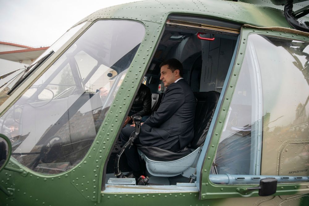 In this handout photo provided by the Ukrainian Presidential Press Office ,Ukrainian President Volodymyr Zelenskiy sits inside a military helicopter as he visits an arm exhibition in Kyiv, Ukraine, Wednesday, Oct. 9, 2019. (Ukrainian Presidential Press Office via AP) In this handout photo provided by the Ukrainian Presidential Press Office ,Ukrainian President Volodymyr Zelenskiy sits inside a military helicopter as he visits an arm exhibition in Kyiv, Ukraine, Wednesday, Oct. 9, 2019. (Ukrainian Presidential Press Office via AP)