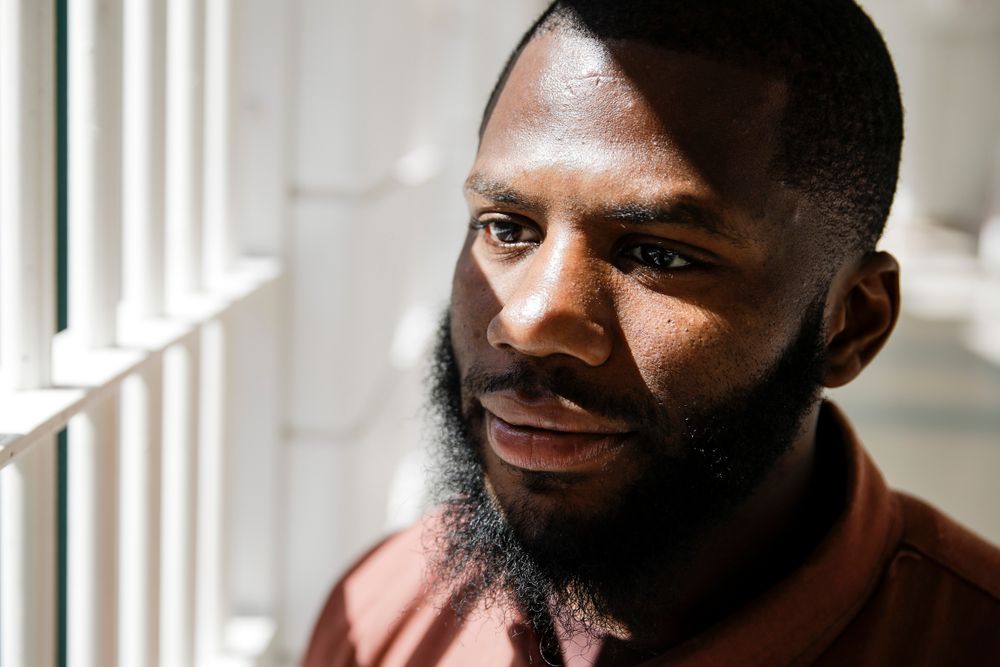 In this Thursday, Aug. 29, 2019 photo incarcerated filmmaker Donyea poses for a portrait at the State Correctional Institution in Chester, Pa. Eastern State Penitentiary, a former prison that's now a museum in Philadelphia is showcasing the work of currently incarcerated filmmakers, projecting the animated shorts onto its outside walls. The new exhibit titled “Hidden Lives Illuminated” offers a glimpse into the lives of these inmates to passersby and museum visitors alike. (AP Photo/Matt Rourke) In this Thursday, Aug. 29, 2019 photo incarcerated filmmaker Donyea poses for a portrait at the State Correctional Institution in Chester, Pa. Eastern State Penitentiary, a former prison that's now a museum in Philadelphia is showcasing the work of currently incarcerated filmmakers, projecting the animated shorts onto its outside walls. The new exhibit titled “Hidden Lives Illuminated” offers a glimpse into the lives of these inmates to passersby and museum visitors alike. (AP Photo/Matt Rourke)