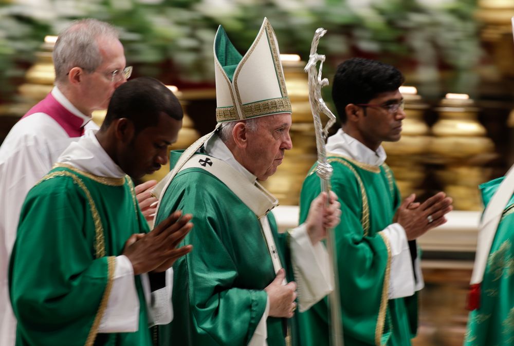 Pope Francis leaves after celebrating an opening Mass for the Amazon synod, in St. Peter's Basilica, at the Vatican, Sunday, Oct. 6, 2019. Pope Francis urged bishops on Sunday to boldly shake up the status quo as they chart ways to better care for the Amazon and its indigenous peoples, amid threats from forest fires, development and what he called ideological Pope Francis leaves after celebrating an opening Mass for the Amazon synod, in St. Peter's Basilica, at the Vatican, Sunday, Oct. 6, 2019. Pope Francis urged bishops on Sunday to boldly shake up the status quo as they chart ways to better care for the Amazon and its indigenous peoples, amid threats from forest fires, development and what he called ideological