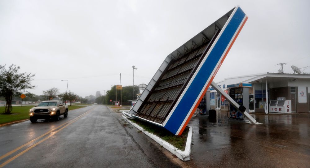 A vehicle passes a toppled gas pump canopy in Berwick, La., following a severe weather assault from Tropical Storm Barry, Saturday, July 13, 2019. (AP Photo/Rogelio V. Solis) A vehicle passes a toppled gas pump canopy in Berwick, La., following a severe weather assault from Tropical Storm Barry, Saturday, July 13, 2019. (AP Photo/Rogelio V. Solis)