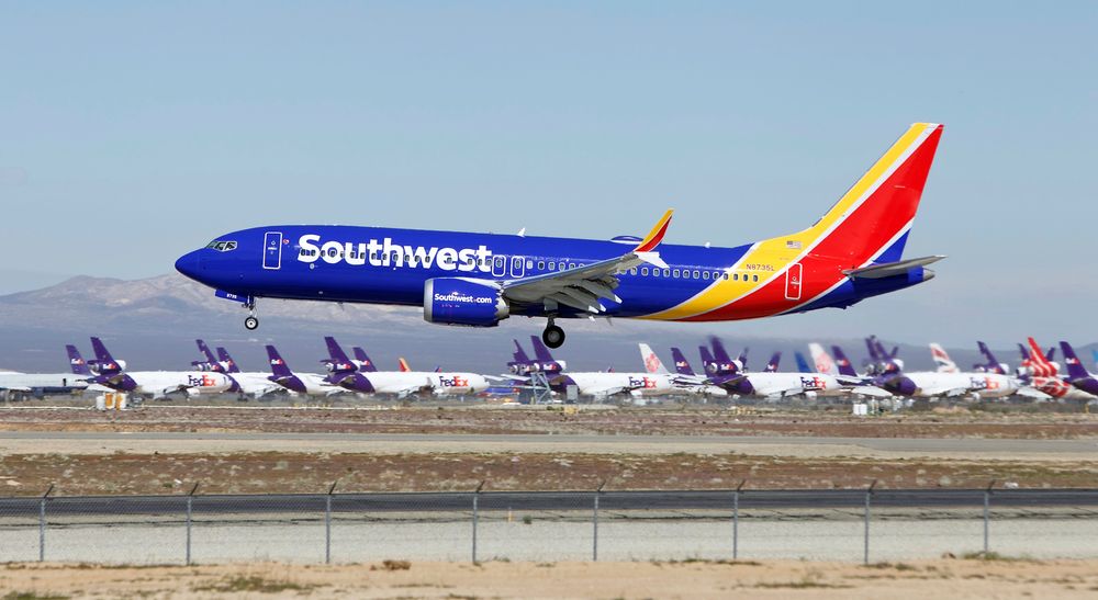 FILE - In this March 23, 2019, file photo, a Southwest Airlines Boeing 737 Max aircraft lands at the Southern California Logistics Airport in the high desert town of Victorville, Calif. A lawsuit filed against Southwest Airlines by a flight attendant alleges pilots on a 2017 flight had an iPad streaming video from a hidden camera in a bathroom in one of the airline's jets. Court filings by attorneys for Dallas-based Southwest and the two pilots denied the livestreaming allegations, and Southwest issued a brief statement Saturday, Oct. 26, saying it would not comment in detail on the suit but denied placing cameras in the lavatories in aircraft. (AP Photo/Matt Hartman, File) FILE - In this March 23, 2019, file photo, a Southwest Airlines Boeing 737 Max aircraft lands at the Southern California Logistics Airport in the high desert town of Victorville, Calif. A lawsuit filed against Southwest Airlines by a flight attendant alleges pilots on a 2017 flight had an iPad streaming video from a hidden camera in a bathroom in one of the airline's jets. Court filings by attorneys for Dallas-based Southwest and the two pilots denied the livestreaming allegations, and Southwest issued a brief statement Saturday, Oct. 26, saying it would not comment in detail on the suit but denied placing cameras in the lavatories in aircraft. (AP Photo/Matt Hartman, File)