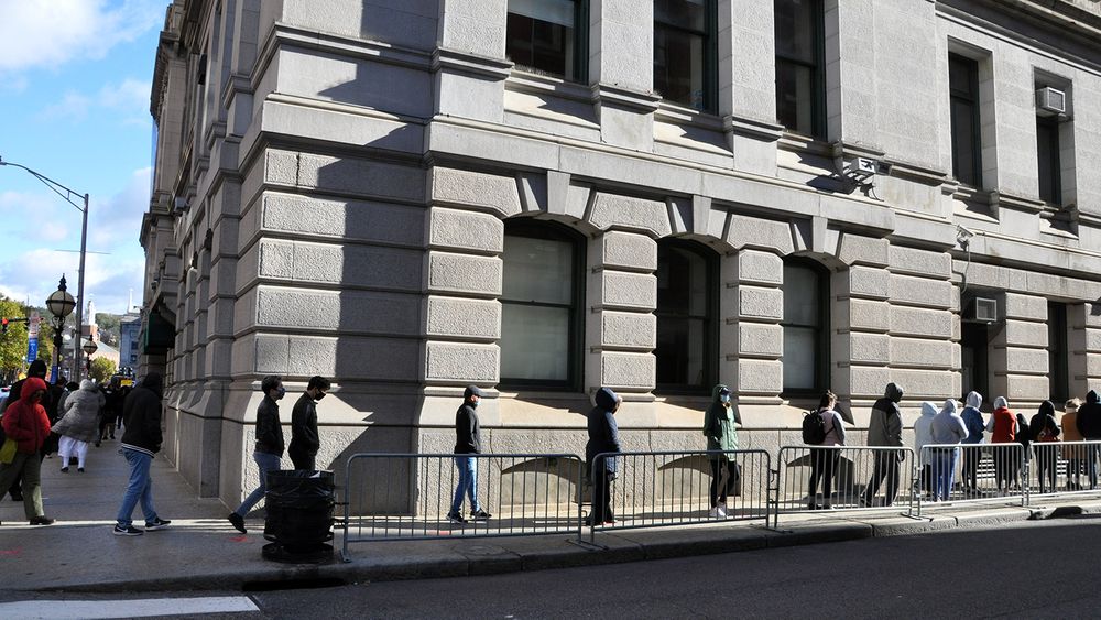 Voters line up outside Providence City Hall, November 2, 2020.