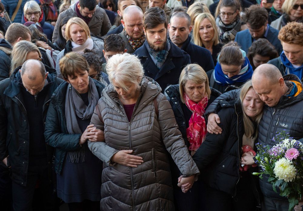 The family of Jack Merritt take part in a vigil at The Guildhall to honour him and Saskia Jones who were both killed in Friday's attack on London Bridge, in Cambridge, England, Monday, Dec. 2, 2019. London Bridge reopened to cars and pedestrians Monday, three days after a man previously convicted of terrorism offenses stabbed two people to death and injured three others before being shot dead by police. (Joe Giddens/PA via AP) The family of Jack Merritt take part in a vigil at The Guildhall to honour him and Saskia Jones who were both killed in Friday's attack on London Bridge, in Cambridge, England, Monday, Dec. 2, 2019. London Bridge reopened to cars and pedestrians Monday, three days after a man previously convicted of terrorism offenses stabbed two people to death and injured three others before being shot dead by police. (Joe Giddens/PA via AP)