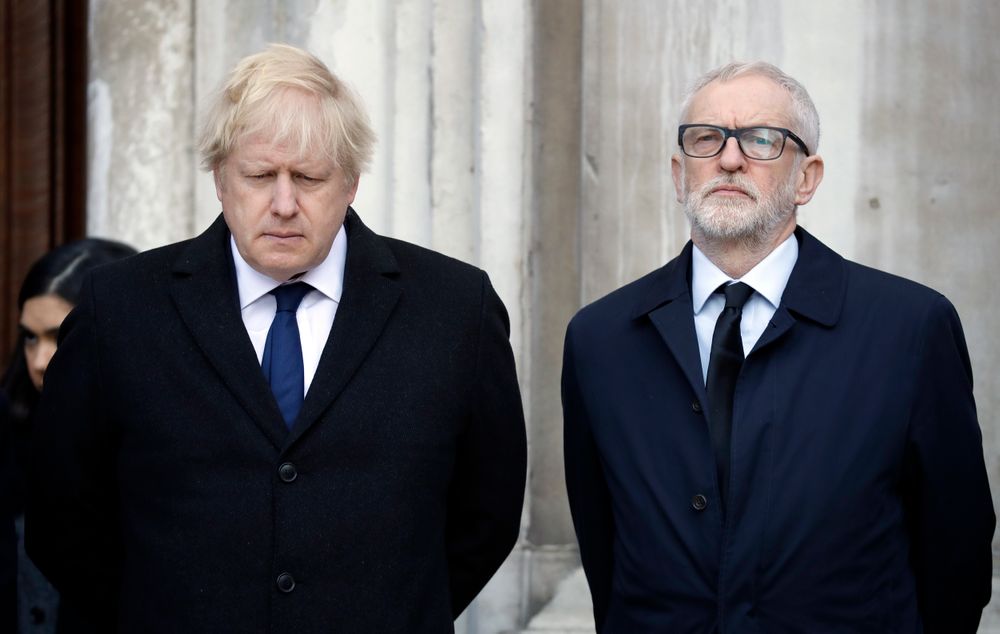Britain's Prime Minister Boris Johnson, left, and Labour Party leader Jeremy Corbyn take part in a vigil at Guildhall Yard in London, Monday Dec. 2, 2019, to remember the London attack victims and honor members of the emergency services and bystanders who fought the attacker. London Bridge reopened to cars and pedestrians Monday, three days after a man previously convicted of terrorism offenses stabbed two people to death and injured three others before being shot dead by police. (AP Photo/Matt Dunham) Britain's Prime Minister Boris Johnson, left, and Labour Party leader Jeremy Corbyn take part in a vigil at Guildhall Yard in London, Monday Dec. 2, 2019, to remember the London attack victims and honor members of the emergency services and bystanders who fought the attacker. London Bridge reopened to cars and pedestrians Monday, three days after a man previously convicted of terrorism offenses stabbed two people to death and injured three others before being shot dead by police. (AP Photo/Matt Dunham)