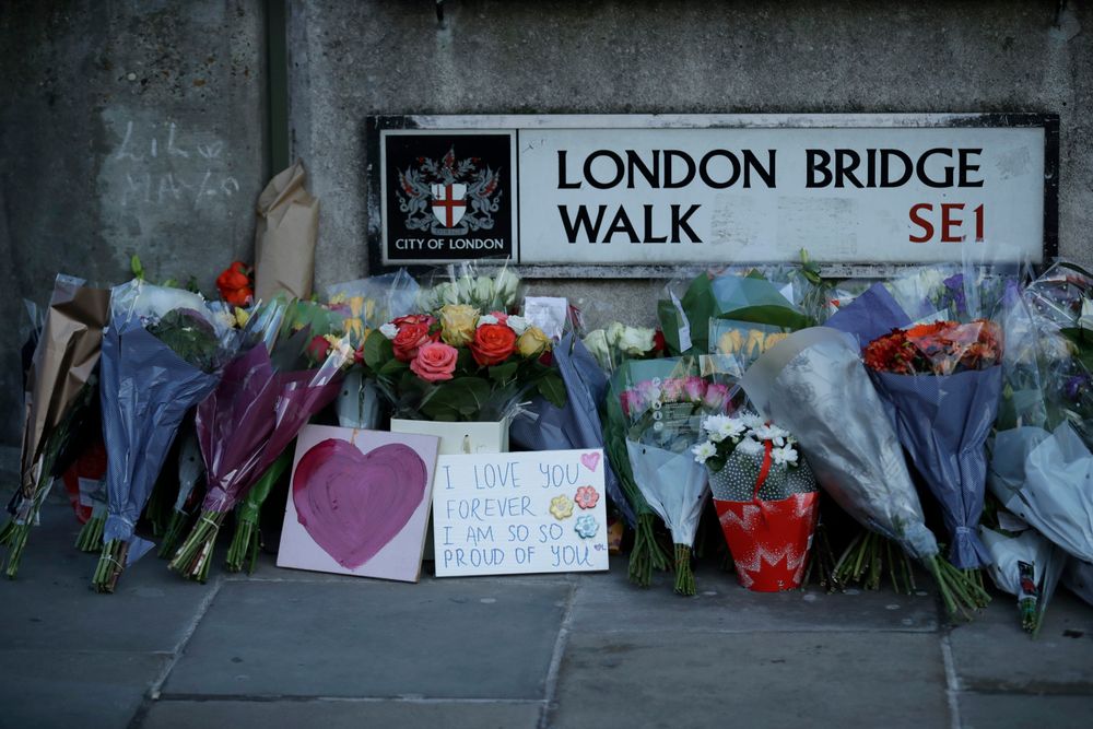 Tributes are placed by the southern end of London Bridge in London, Monday, Dec. 2, 2019. London Bridge reopened to cars and pedestrians Monday, three days after a man previously convicted of terrorism offenses stabbed two people to death and injured three others before being shot dead by police. (AP Photo/Matt Dunham) Tributes are placed by the southern end of London Bridge in London, Monday, Dec. 2, 2019. London Bridge reopened to cars and pedestrians Monday, three days after a man previously convicted of terrorism offenses stabbed two people to death and injured three others before being shot dead by police. (AP Photo/Matt Dunham)