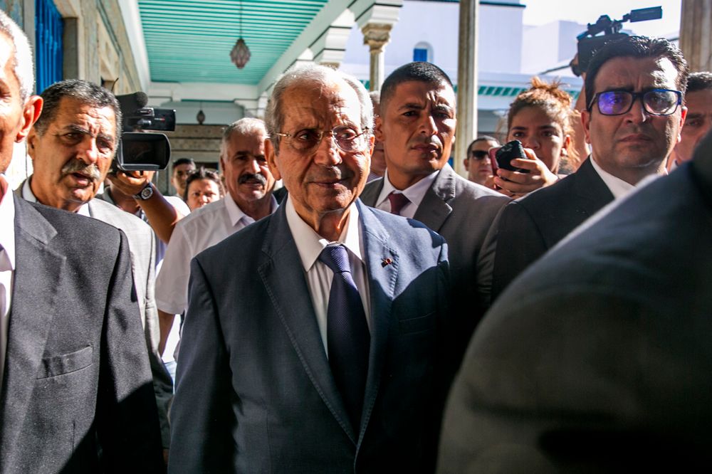 Tunisian parliament president Mohamed Ennaceur, center, arrives to be sworn in as Interim president in Tunis, Tunisia, Thursday, July 25, 2019. Ennaceur, the leader of Tunisia's parliament has been sworn in as the interim president of the North African country after 92-year-old President Beji Essebsi died in office. The state news agency TAP reported that Mohamed Ennaceur, president of the Assembly of People's Representatives, took the oath of office Thursday July 25, hours after Essebsi's death in the morning. (AP Photo/Hassene Dridi) Tunisian parliament president Mohamed Ennaceur, center, arrives to be sworn in as Interim president in Tunis, Tunisia, Thursday, July 25, 2019. Ennaceur, the leader of Tunisia's parliament has been sworn in as the interim president of the North African country after 92-year-old President Beji Essebsi died in office. The state news agency TAP reported that Mohamed Ennaceur, president of the Assembly of People's Representatives, took the oath of office Thursday July 25, hours after Essebsi's death in the morning. (AP Photo/Hassene Dridi)