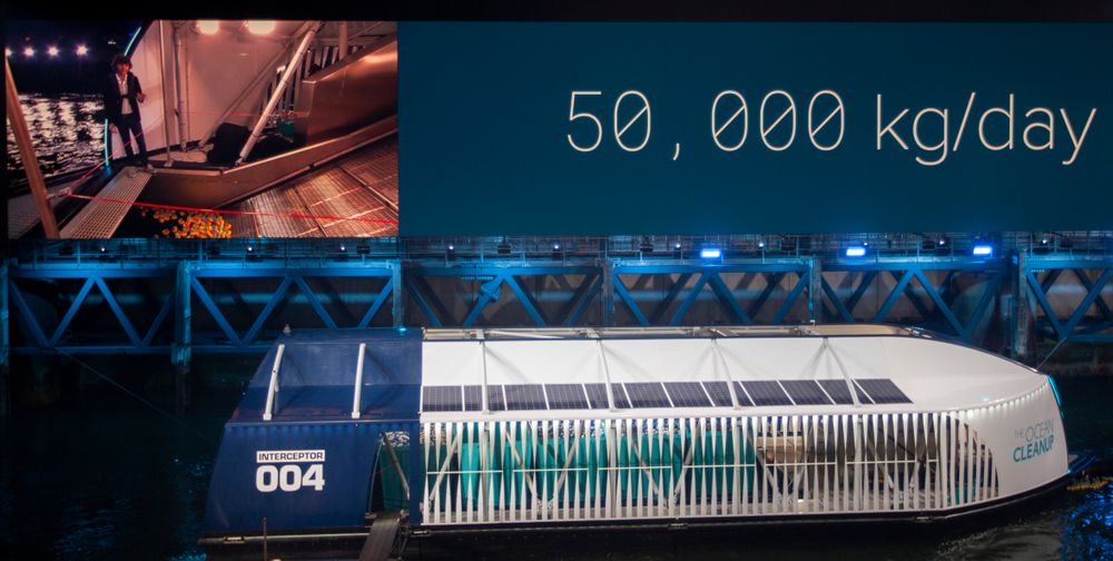 Young Dutch inventor Boyan Slat, on screen left, unveils the Interceptor in Rotterdam, Netherlands, Saturday, Oct. 26, 2019. Slat is taking his effort to clean up floating plastic from the Pacific Ocean to rivers, using the Interceptor, a new floating device to catch garbage before it reaches the seas. The device is able to send a message to a mobile phone when it's full. (AP Photo/Peter Dejong) Young Dutch inventor Boyan Slat, on screen left, unveils the Interceptor in Rotterdam, Netherlands, Saturday, Oct. 26, 2019. Slat is taking his effort to clean up floating plastic from the Pacific Ocean to rivers, using the Interceptor, a new floating device to catch garbage before it reaches the seas. The device is able to send a message to a mobile phone when it's full. (AP Photo/Peter Dejong)