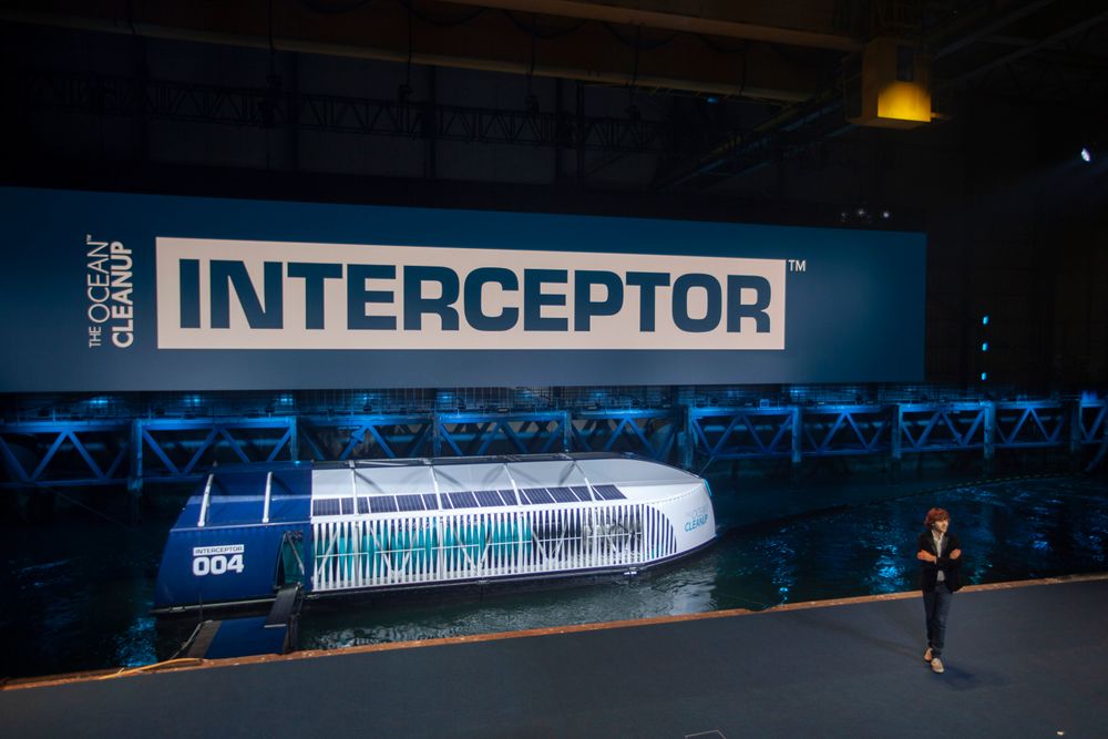 Young Dutch inventor Boyan Slat, right, unveils the Interceptor in Rotterdam, Netherlands, Saturday, Oct. 26, 2019. Slat is taking his effort to clean up floating plastic from the Pacific Ocean to rivers, using the Interceptor, a new floating device to catch garbage before it reaches the seas. (AP Photo/Peter Dejong) Young Dutch inventor Boyan Slat, right, unveils the Interceptor in Rotterdam, Netherlands, Saturday, Oct. 26, 2019. Slat is taking his effort to clean up floating plastic from the Pacific Ocean to rivers, using the Interceptor, a new floating device to catch garbage before it reaches the seas. (AP Photo/Peter Dejong)