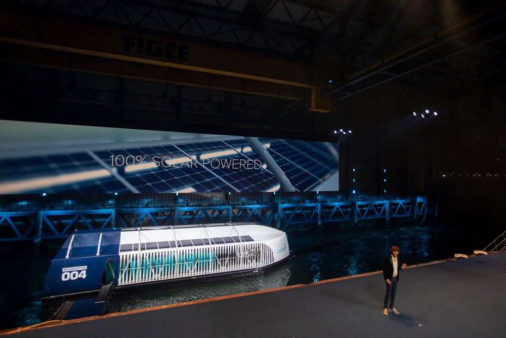 Young Dutch inventor Boyan Slat, right, unveils the Interceptor in Rotterdam, Netherlands, Saturday, Oct. 26, 2019. Slat is taking his effort to clean up floating plastic from the Pacific Ocean to rivers, using the Interceptor, a new floating device to catch garbage before it reaches the seas. (AP Photo/Peter Dejong) Young Dutch inventor Boyan Slat, right, unveils the Interceptor in Rotterdam, Netherlands, Saturday, Oct. 26, 2019. Slat is taking his effort to clean up floating plastic from the Pacific Ocean to rivers, using the Interceptor, a new floating device to catch garbage before it reaches the seas. (AP Photo/Peter Dejong)