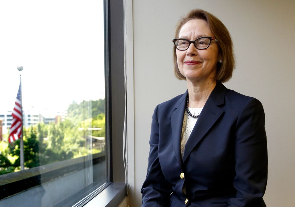 FILE - In this July 13, 2016 file photo, Oregon Attorney General Ellen Rosenblum poses for a photo at her office in Portland, Ore. Oregon's attorney general is telling the U.S. Supreme Court that Oregon's criminal justice system would be FILE - In this July 13, 2016 file photo, Oregon Attorney General Ellen Rosenblum poses for a photo at her office in Portland, Ore. Oregon's attorney general is telling the U.S. Supreme Court that Oregon's criminal justice system would be