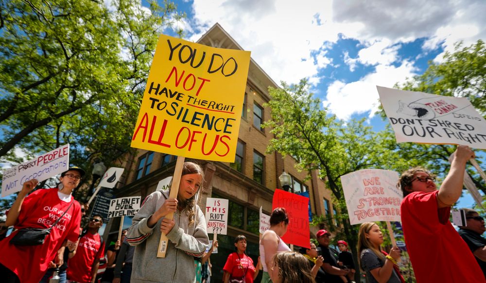FILE - In this June 12, 2019 file photo demonstrators walk to Andrew W. Bogue Federal Courthouse as they protest against the Keystone XL pipeline in Rapid City, S.D. South Dakota's Rosebud Sioux tribe and two tribes in Montana are suing the Trump administration in a bid to block the controversial oil pipeline. (Adam Fondren/Rapid City Journal via AP, File) FILE - In this June 12, 2019 file photo demonstrators walk to Andrew W. Bogue Federal Courthouse as they protest against the Keystone XL pipeline in Rapid City, S.D. South Dakota's Rosebud Sioux tribe and two tribes in Montana are suing the Trump administration in a bid to block the controversial oil pipeline. (Adam Fondren/Rapid City Journal via AP, File)