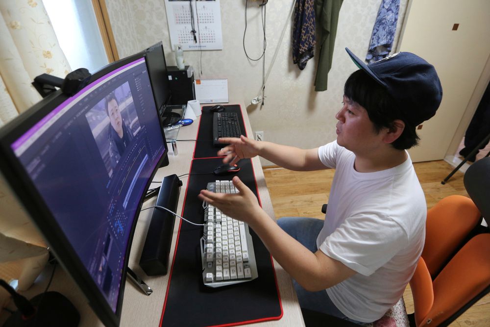 In this July 18, 2019, photo, North Korean refugee Jang Myung-jin edits his YouTube footage during an interview at his house in Seoul, South Korea. The 32-year-old Jang is among a handful of young North Korean refugees in South Korea who have launched YouTube channels that offer a rare glimpse into the everyday lives of people in North Korea, one of the world’s most secretive and repressive countries. (AP Photo/Ahn Young-joon) In this July 18, 2019, photo, North Korean refugee Jang Myung-jin edits his YouTube footage during an interview at his house in Seoul, South Korea. The 32-year-old Jang is among a handful of young North Korean refugees in South Korea who have launched YouTube channels that offer a rare glimpse into the everyday lives of people in North Korea, one of the world’s most secretive and repressive countries. (AP Photo/Ahn Young-joon)