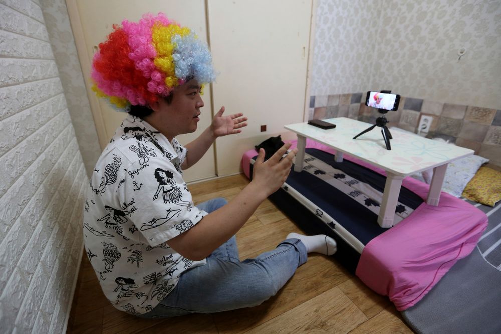 In this July 18, 2019, photo, North Korean refugee Jang Myung-jin films himself in a demonstration of his YouTube broadcast during an interview at his house in Seoul, South Korea. The 32-year-old Jang is among a handful of young North Korean refugees in South Korea who have launched YouTube channels that offer a rare glimpse into the everyday lives of people in North Korea, one of the world’s most secretive and repressive countries. (AP Photo/Ahn Young-joon) In this July 18, 2019, photo, North Korean refugee Jang Myung-jin films himself in a demonstration of his YouTube broadcast during an interview at his house in Seoul, South Korea. The 32-year-old Jang is among a handful of young North Korean refugees in South Korea who have launched YouTube channels that offer a rare glimpse into the everyday lives of people in North Korea, one of the world’s most secretive and repressive countries. (AP Photo/Ahn Young-joon)