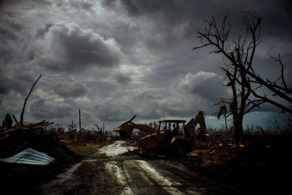 Mos Antenor, 42, drives a bulldozer while clearing the road after Hurricane Dorian Mclean's Town, Grand Bahama, Bahamas, Friday Sept. 13, 2019. (AP Photo/Ramon Espinosa) Mos Antenor, 42, drives a bulldozer while clearing the road after Hurricane Dorian Mclean's Town, Grand Bahama, Bahamas, Friday Sept. 13, 2019. (AP Photo/Ramon Espinosa)