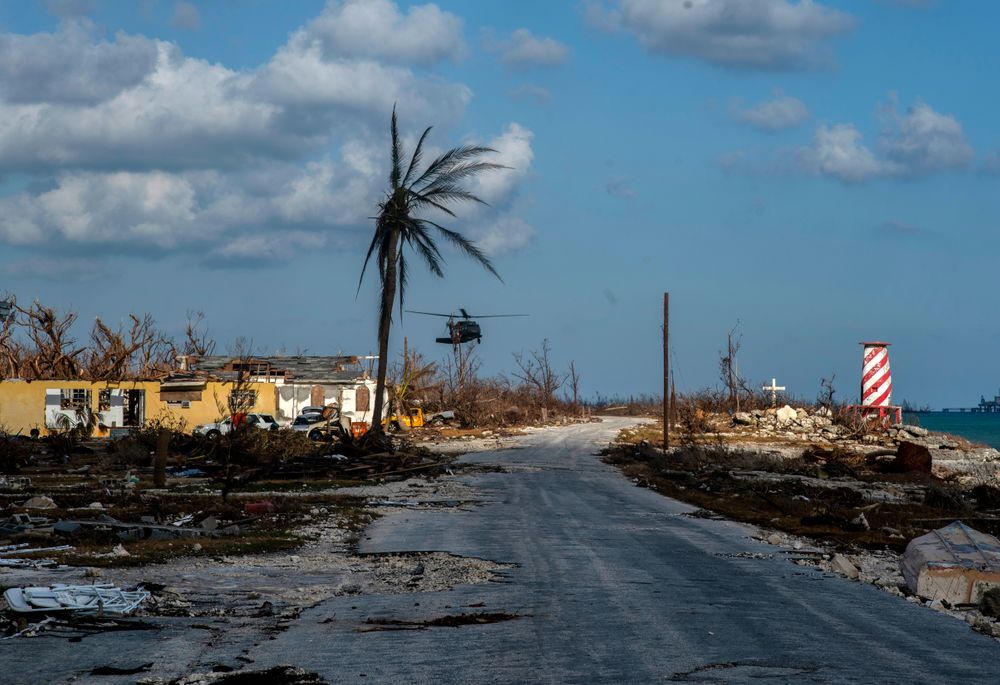 A helicopter flies over the village of High Rock after delivering emergency supplies in the aftermath of Hurricane Dorian In High Rock, Grand Bahama, Bahamas, Tuesday, September 10, 2019. (AP Photo / Ramon Espinosa) A helicopter flies over the village of High Rock after delivering emergency supplies in the aftermath of Hurricane Dorian In High Rock, Grand Bahama, Bahamas, Tuesday, September 10, 2019. (AP Photo / Ramon Espinosa)