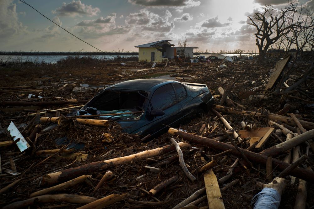 A car is sunk in the wreckage and debris caused by Hurricane Dorian, in Mclean's Town, Grand Bahama, Bahamas, Wednesday Sept. 11, 2019. Bahamians are tackling a massive clean-up a week after Hurricane Dorian devastated the archipelago’s northern islands. Residents sift through debris as they try to save prized possessions and prepare to rebuild from one of the strongest Atlantic hurricanes in history. (AP Photo/Ramon Espinosa) A car is sunk in the wreckage and debris caused by Hurricane Dorian, in Mclean's Town, Grand Bahama, Bahamas, Wednesday Sept. 11, 2019. Bahamians are tackling a massive clean-up a week after Hurricane Dorian devastated the archipelago’s northern islands. Residents sift through debris as they try to save prized possessions and prepare to rebuild from one of the strongest Atlantic hurricanes in history. (AP Photo/Ramon Espinosa)