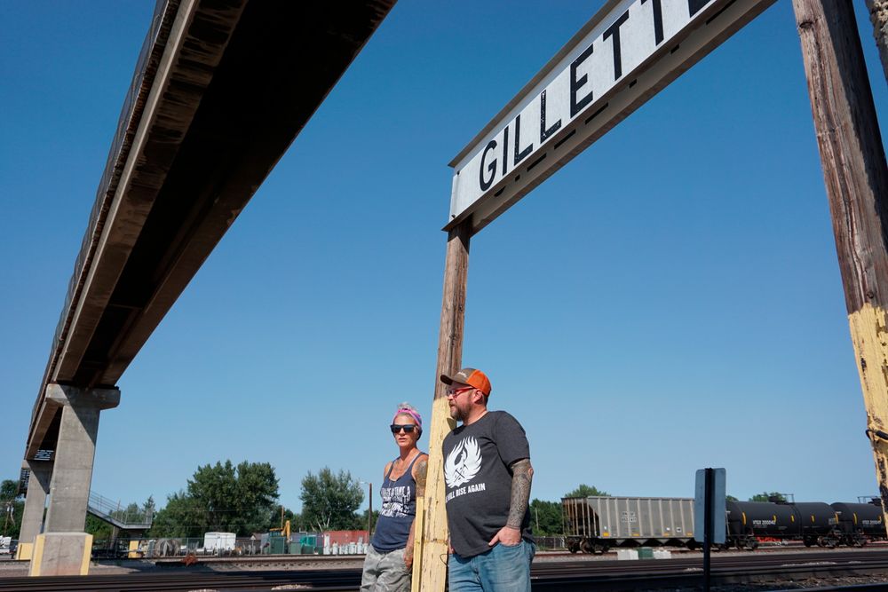 In this Thursday, Sept. 5, 2019 photo shows warehouse technician Melissa Worden, left, and heavy equipment operator Rory Wallet, in downtown Gillette, Wyo. The shutdown of Blackjewel LLC's Belle Ayr and Eagle Butte mines in Wyoming since July 1, 2019, has added yet more uncertainty to the Powder River Basin's struggling coal economy. Both Worden and Wallet wonder if they will get their old jobs back. (AP Photo/Mead Gruver) In this Thursday, Sept. 5, 2019 photo shows warehouse technician Melissa Worden, left, and heavy equipment operator Rory Wallet, in downtown Gillette, Wyo. The shutdown of Blackjewel LLC's Belle Ayr and Eagle Butte mines in Wyoming since July 1, 2019, has added yet more uncertainty to the Powder River Basin's struggling coal economy. Both Worden and Wallet wonder if they will get their old jobs back. (AP Photo/Mead Gruver)