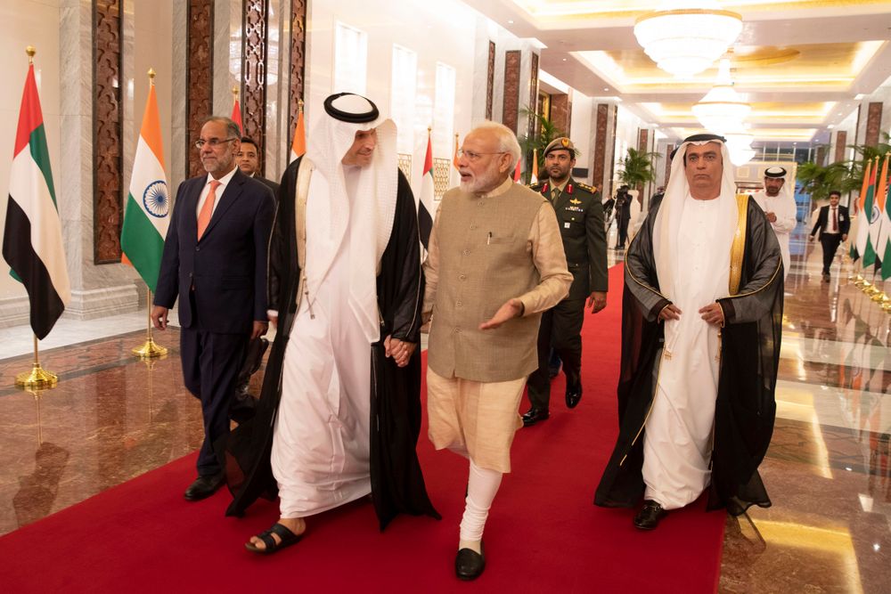In this photo released by the state-run WAM news agency, Indian Prime Minister Narendra Modi, center right, walks with Khaldoon Khalifa al-Mubarak, chairman of the Abu Dhabi Executive Affairs Authority, center left, after arriving in Abu Dhabi, United Arab Emirates, Friday, Aug. 23, 2019. Modi is on a trip to both the United Arab Emirates and Bahrain, reinforcing ties between India and the Gulf Arab nations as he pursues stripping statehood from the disputed Muslim-majority region of Kashmir. (WAM via AP) In this photo released by the state-run WAM news agency, Indian Prime Minister Narendra Modi, center right, walks with Khaldoon Khalifa al-Mubarak, chairman of the Abu Dhabi Executive Affairs Authority, center left, after arriving in Abu Dhabi, United Arab Emirates, Friday, Aug. 23, 2019. Modi is on a trip to both the United Arab Emirates and Bahrain, reinforcing ties between India and the Gulf Arab nations as he pursues stripping statehood from the disputed Muslim-majority region of Kashmir. (WAM via AP)