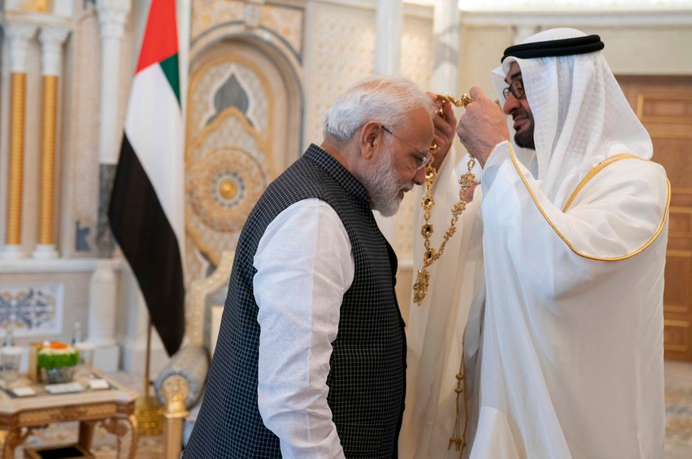 In this photograph made available by the state-run WAM news agency, Indian Prime Minister Narendra Modi, left, receives a medal during his induction to the Order of Zayed from Sheikh Mohammed bin Zayed Al Nahyan, right, in Abu Dhabi, United Arab Emirates, Saturday, Aug. 24, 2019. Modi is on a trip to both the United Arab Emirates and Bahrain, reinforcing ties between India and the Gulf Arab nations as he pursues stripping statehood from the disputed Muslim-majority region of Kashmir. (Hamad al-Kaabi - Ministry of Presidential Affairs/WAM via AP) In this photograph made available by the state-run WAM news agency, Indian Prime Minister Narendra Modi, left, receives a medal during his induction to the Order of Zayed from Sheikh Mohammed bin Zayed Al Nahyan, right, in Abu Dhabi, United Arab Emirates, Saturday, Aug. 24, 2019. Modi is on a trip to both the United Arab Emirates and Bahrain, reinforcing ties between India and the Gulf Arab nations as he pursues stripping statehood from the disputed Muslim-majority region of Kashmir. (Hamad al-Kaabi - Ministry of Presidential Affairs/WAM via AP)