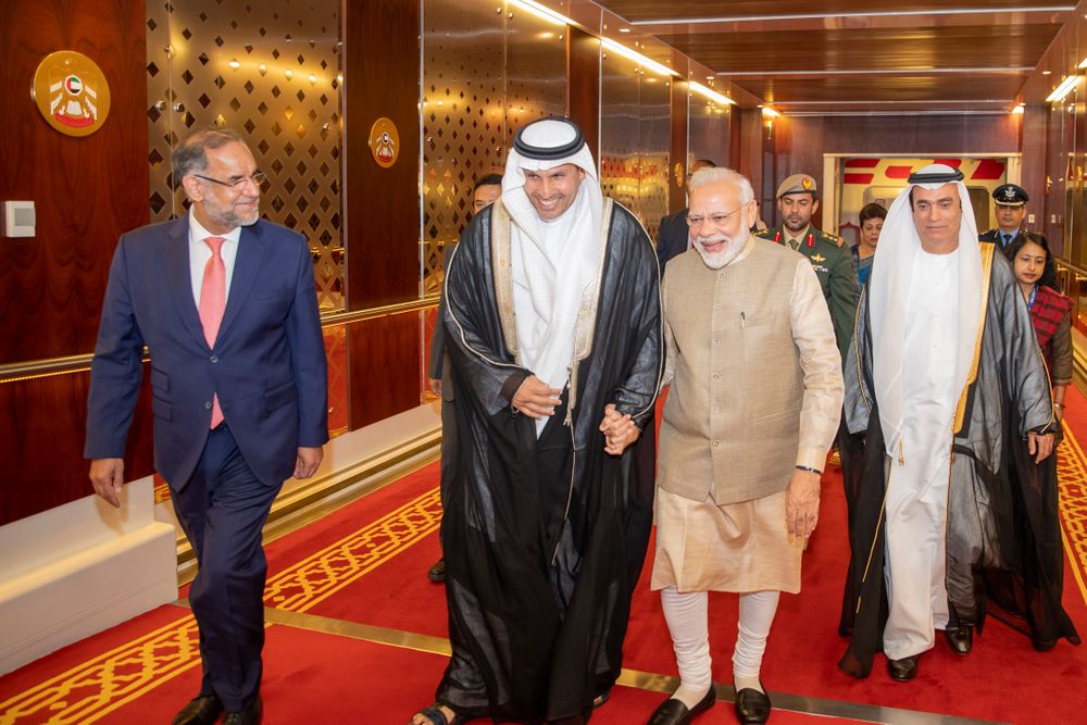 In this photo released by the state-run WAM news agency, Indian Prime Minister Narendra Modi, second from right, walks with Khaldoon Khalifa al-Mubarak, second from left, chairman of the Abu Dhabi Executive Affairs Authority, after arriving in Abu Dhabi, United Arab Emirates, Friday, Aug. 23, 2019. Modi is on a trip to both the United Arab Emirates and Bahrain, reinforcing ties between India and the Gulf Arab nations as he pursues stripping statehood from the disputed Muslim-majority region of Kashmir. (WAM via AP) In this photo released by the state-run WAM news agency, Indian Prime Minister Narendra Modi, second from right, walks with Khaldoon Khalifa al-Mubarak, second from left, chairman of the Abu Dhabi Executive Affairs Authority, after arriving in Abu Dhabi, United Arab Emirates, Friday, Aug. 23, 2019. Modi is on a trip to both the United Arab Emirates and Bahrain, reinforcing ties between India and the Gulf Arab nations as he pursues stripping statehood from the disputed Muslim-majority region of Kashmir. (WAM via AP)