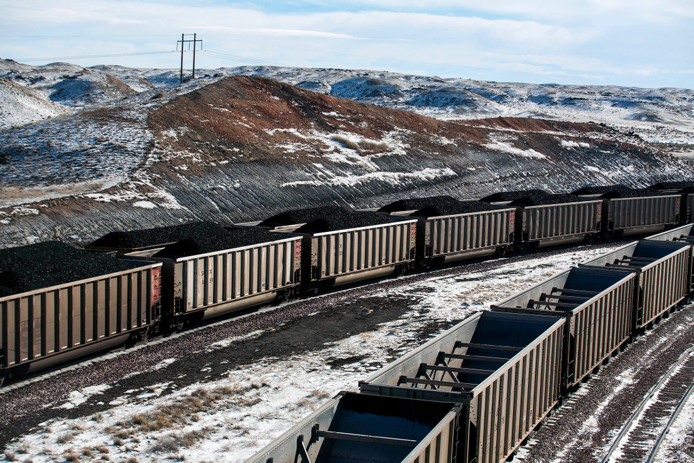FILE - In this Jan. 9, 2014, file photo, rail cars are filled with coal and sprayed with a topper agent to suppress dust at Cloud Peak Energy's Antelope Mine north of Douglas, Wyo. Four states with climate change worries are asking a judge to stop the Trump administration from selling coal from public lands. Attorneys general from California, New Mexico, New York and Washington are due in a U.S. courtroom in Montana on Thursday, Dec. 13, 2018, to argue the sales put the climate at risk and shortchange taxpayers. Federal officials say the Trump administration's decision to lift a moratorium on coal sales from public lands could hasten the release of more than 5 billion tons of greenhouse gasses. (Ryan Dorgan/The Casper Star-Tribune via AP, File) FILE - In this Jan. 9, 2014, file photo, rail cars are filled with coal and sprayed with a topper agent to suppress dust at Cloud Peak Energy's Antelope Mine north of Douglas, Wyo. Four states with climate change worries are asking a judge to stop the Trump administration from selling coal from public lands. Attorneys general from California, New Mexico, New York and Washington are due in a U.S. courtroom in Montana on Thursday, Dec. 13, 2018, to argue the sales put the climate at risk and shortchange taxpayers. Federal officials say the Trump administration's decision to lift a moratorium on coal sales from public lands could hasten the release of more than 5 billion tons of greenhouse gasses. (Ryan Dorgan/The Casper Star-Tribune via AP, File)